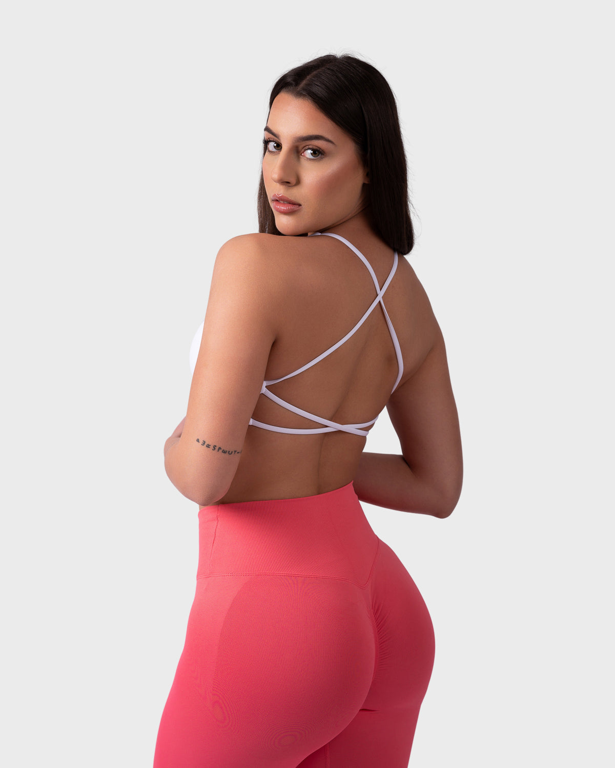 PWG Active Evolve Backless Sports Bra in White, breathable, high-performance, with front logo design - Back View