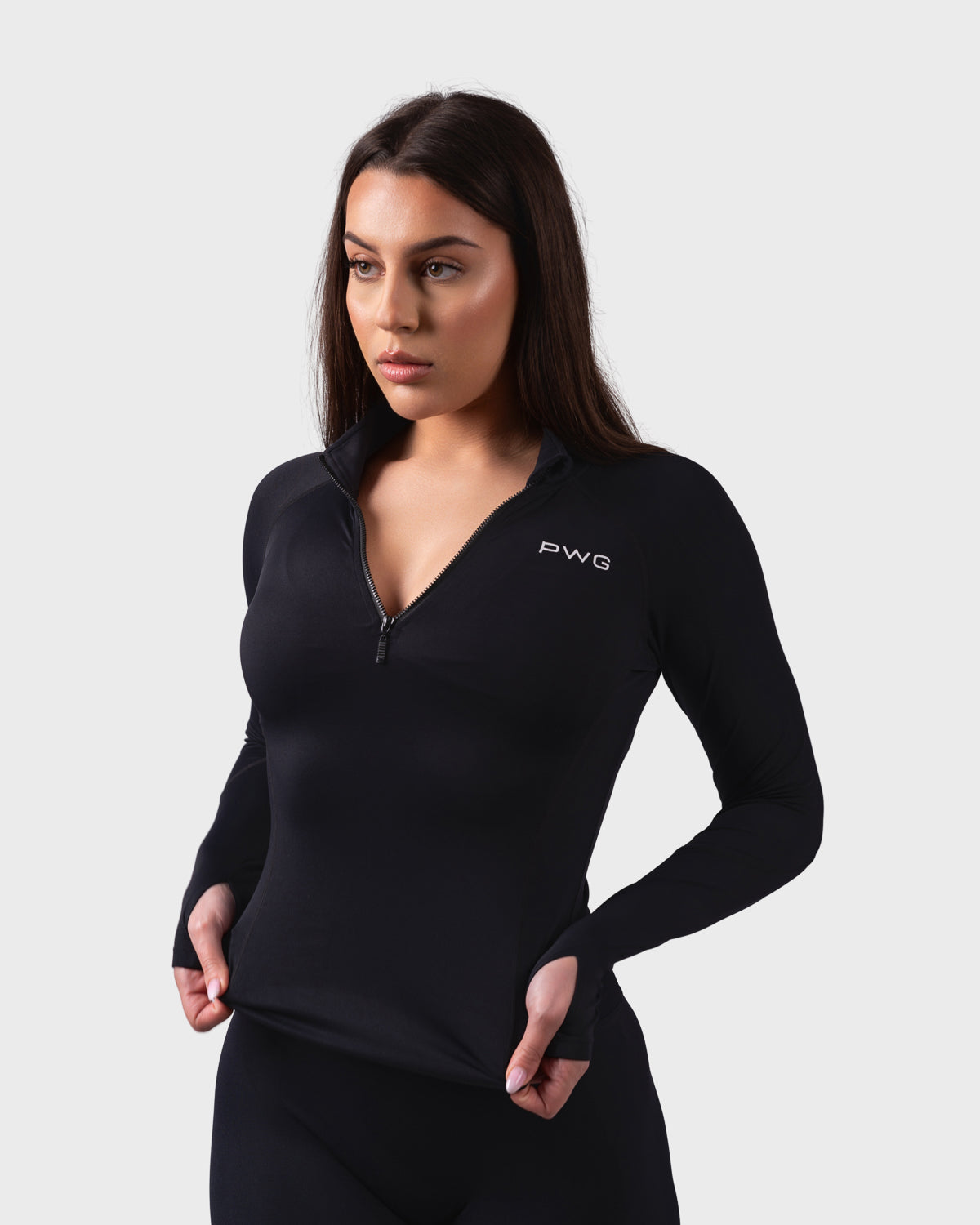 PWG Active Evolve 1/4 Zip Pullover in Black, breathable fabric, high neck, front PWG logo, and thumbhole sleeves for performance