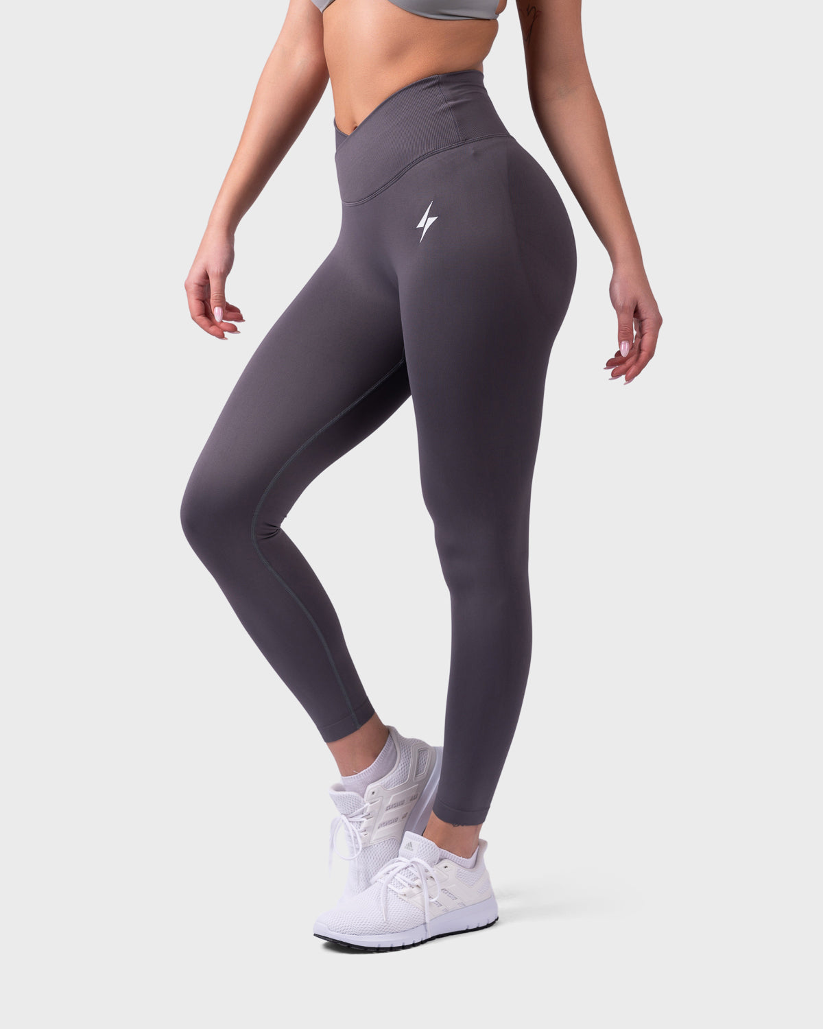 Side view of Evolve Leggings in onyx, showcasing stretch fit and ankle length.