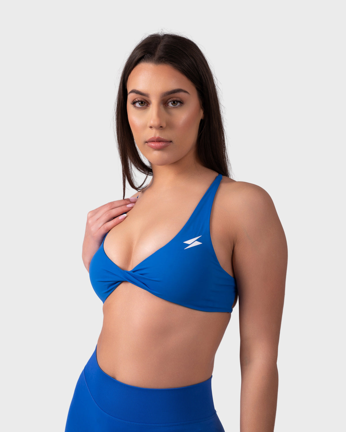 PWG Active Evolve Backless Sports Bra in Electric Blue, breathable, high-performance, with front logo design
