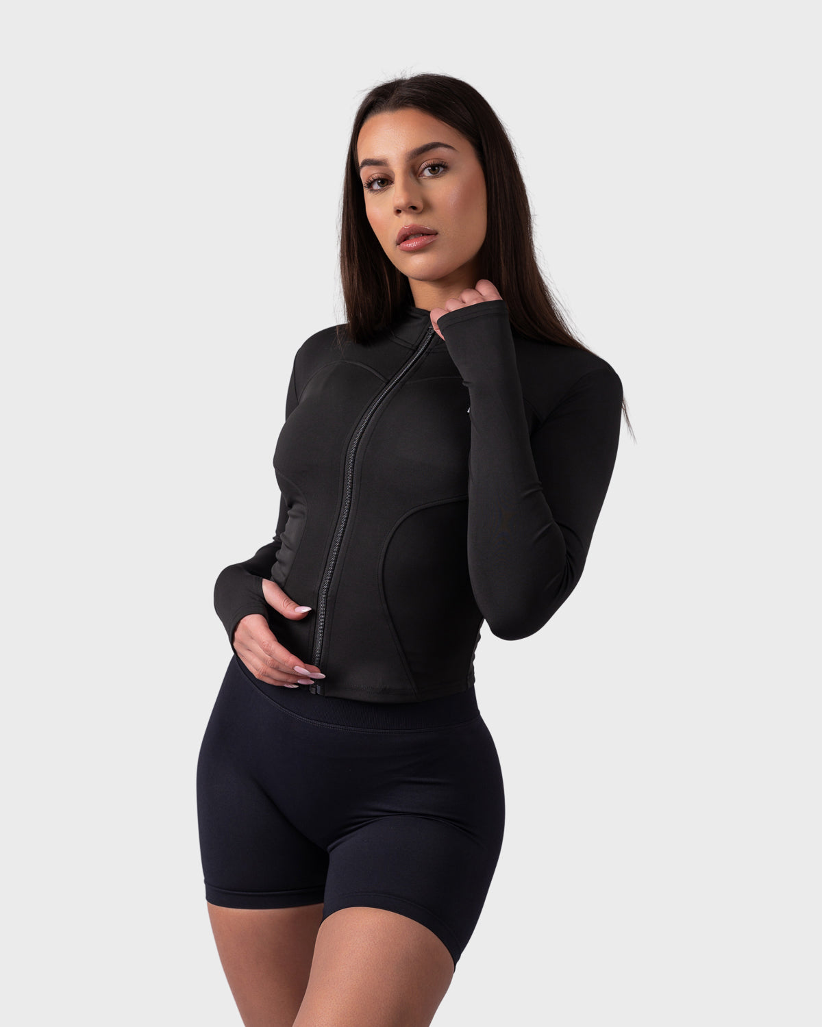 Front angle of Evolve Jacket in black, showcasing stretch fabric and fitted shape.