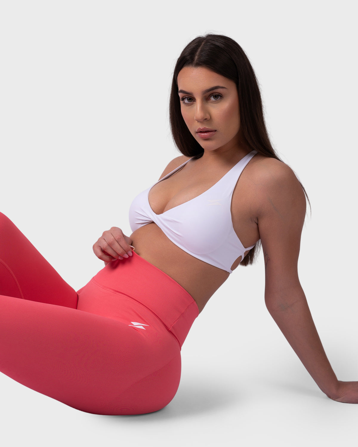 PWG Active Evolve Backless Sports Bra in White, breathable, high-performance, with front logo design