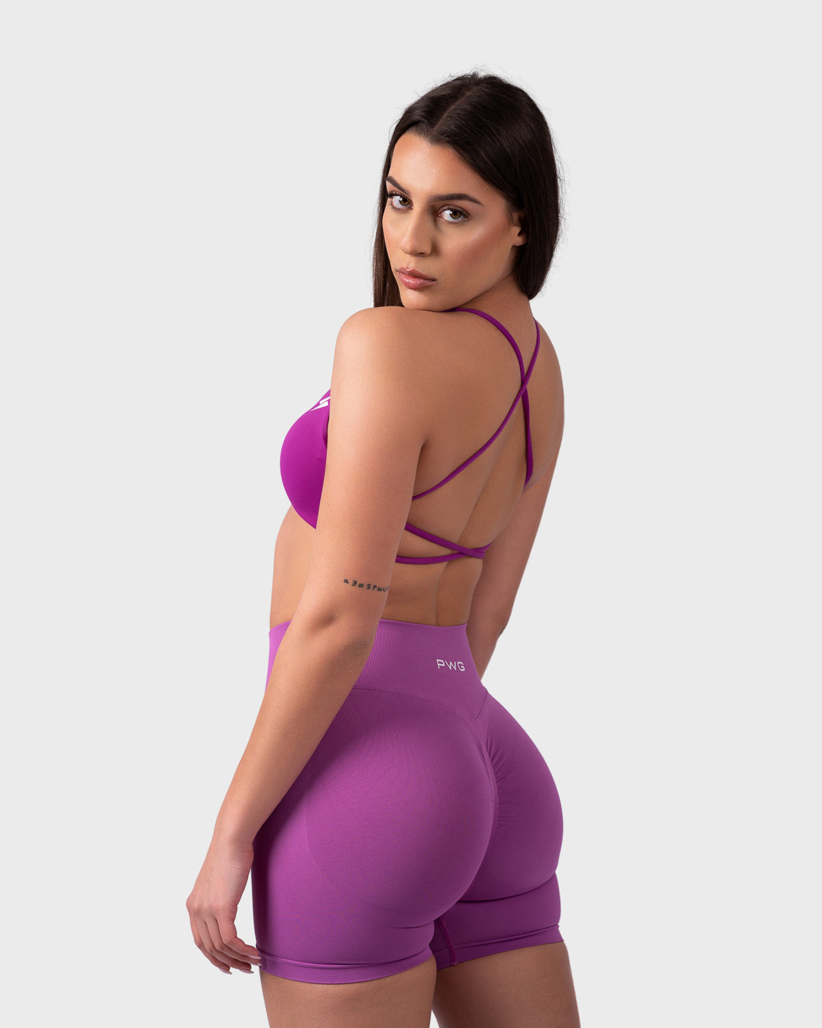Rear quarter view of Evolve Backless Sports Bra, highlighting supportive cross-back straps.