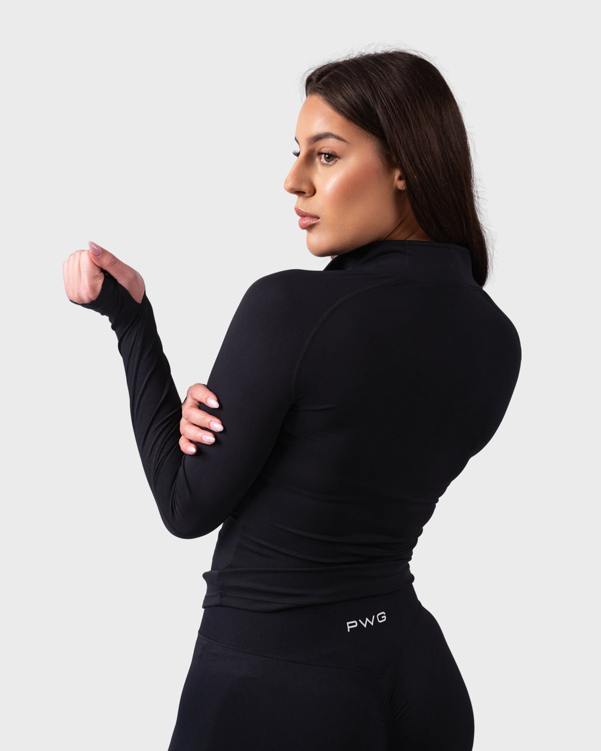 PWG Active Evolve 1/4 Zip Pullover in Black, breathable fabric, high neck, front PWG logo, and thumbhole sleeves for performance - Back View