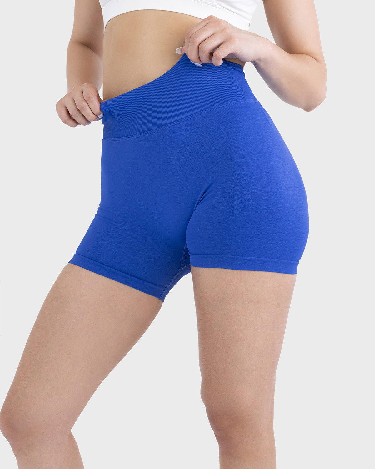 PWG Active Form Sculpting Shorts in Midnight Sapphire, high ribbed waistband, sculpting design, scrunch back, 4” inseam - Front View