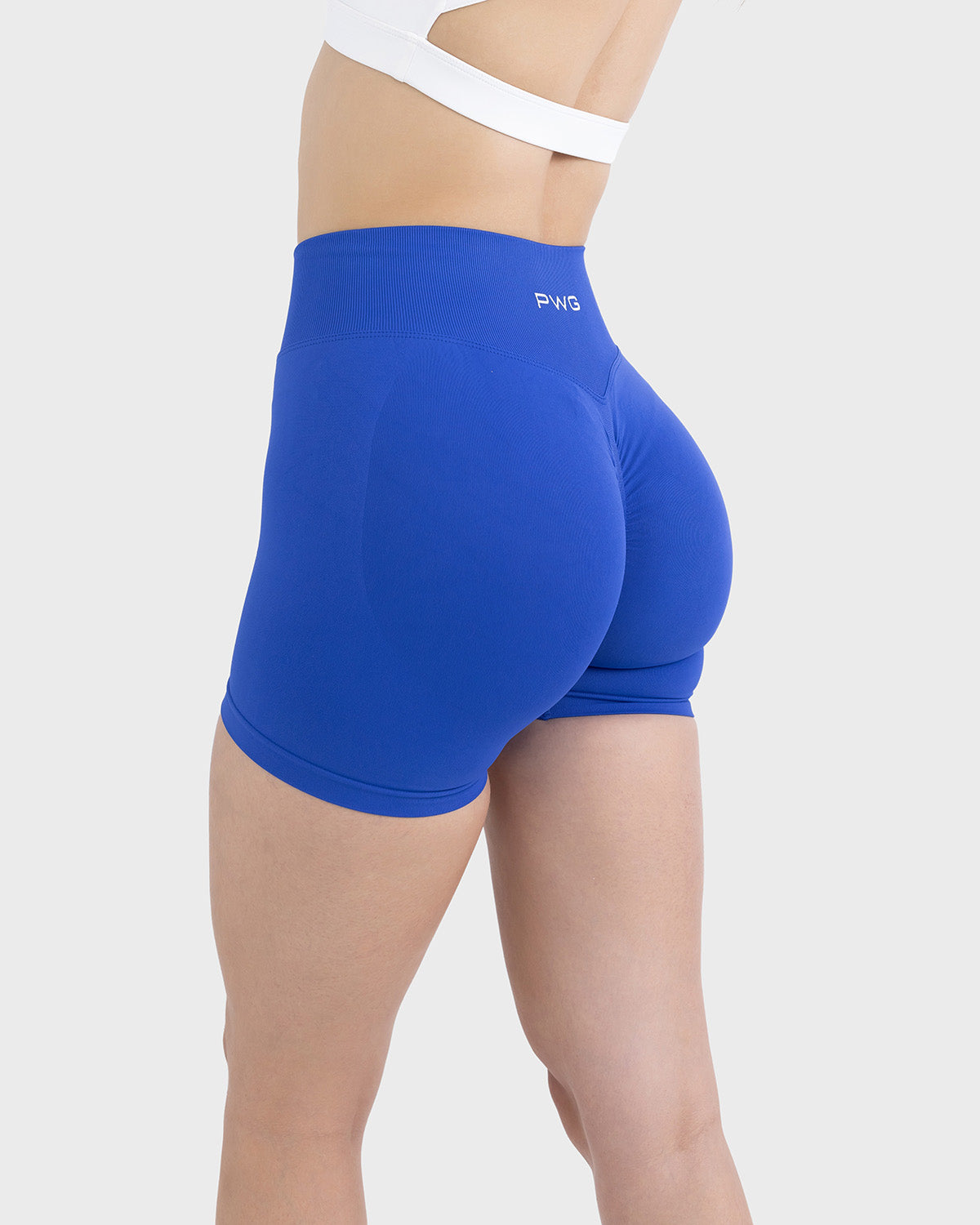 PWG Active Form Sculpting Shorts in Midnight Sapphire, high ribbed waistband, sculpting design, scrunch back, 4” inseam - Side View
