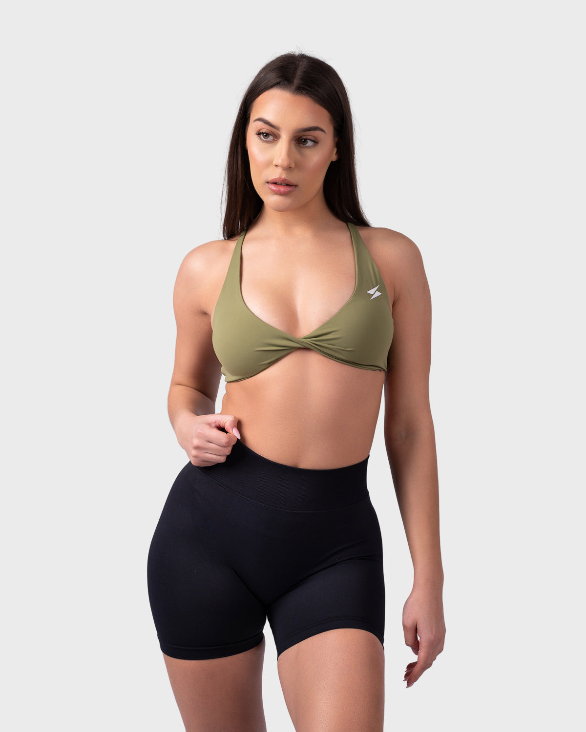 PWG Active Evolve Backless Sports Bra in Olive Green, breathable, high-performance, with front logo design - Front View
