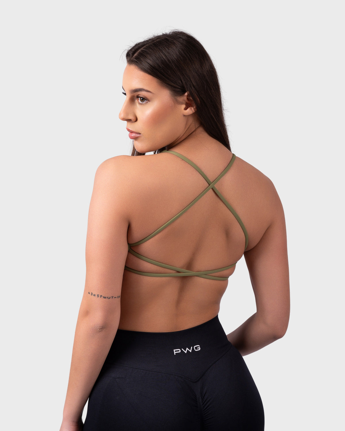 PWG Active Evolve Backless Sports Bra in Olive Green, breathable, high-performance, with front logo design - Back View
