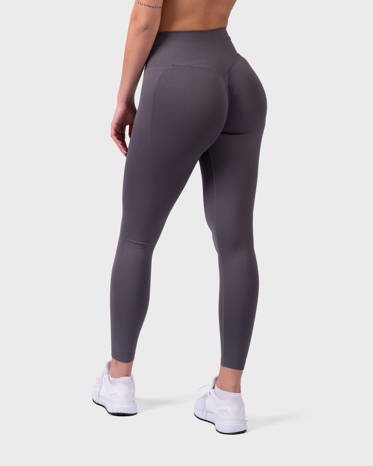 Evolve V-Sculpt Leggings from PWG Active in onyx, rear view with glute-sculpting fit.