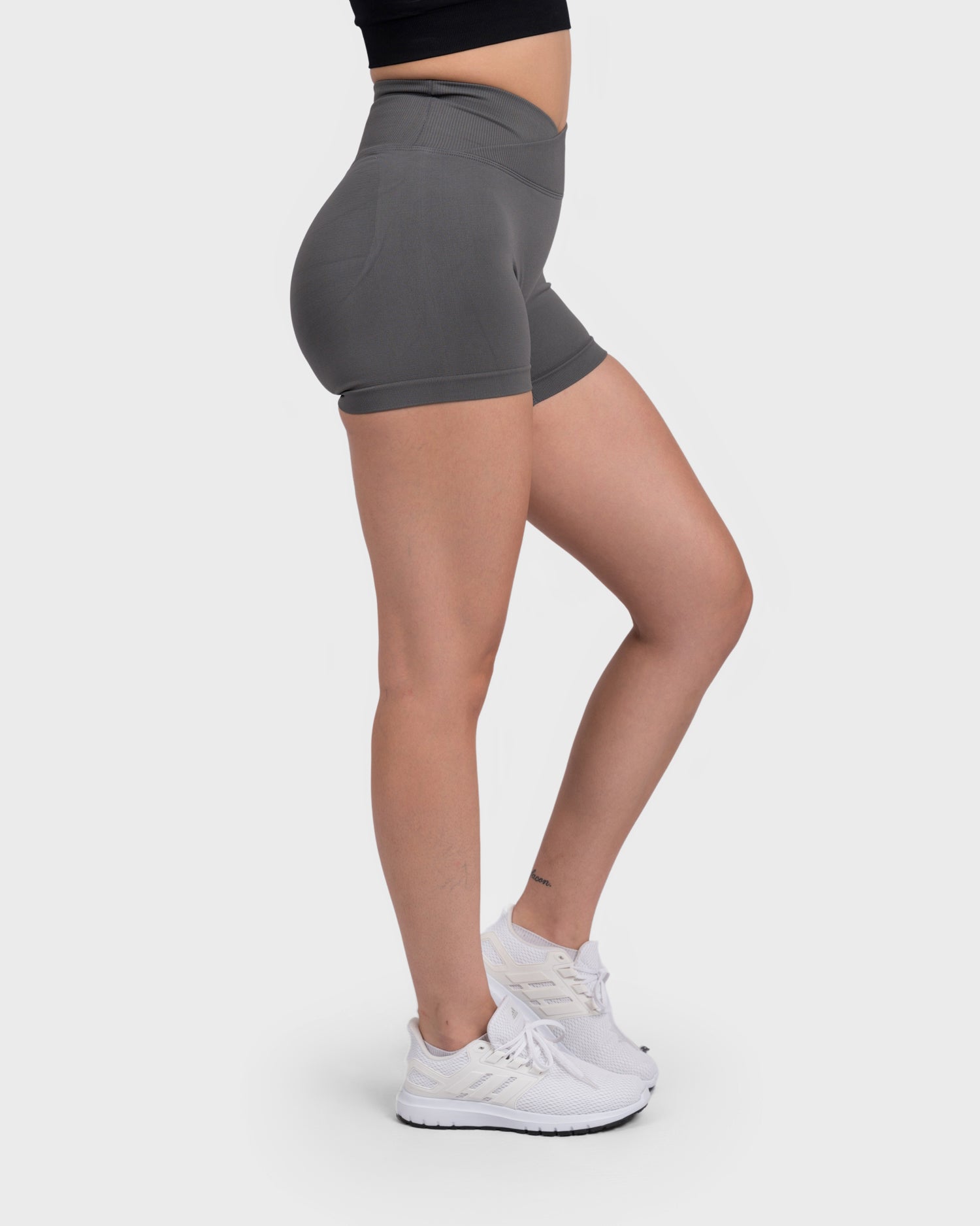 PWG Active Evolve V-Sculpt Shorts in Dark Grey – High-waisted, form-fitting gym shorts with a stylish V-cut waistband.