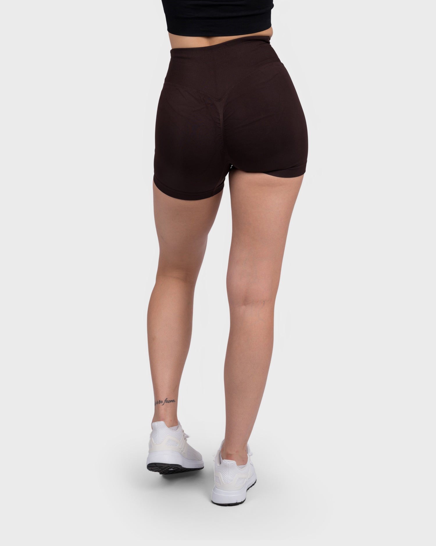 PWG Active Evolve V-Sculpt Shorts in Dark Brown – High-waisted, form-fitting gym shorts with a stylish V-cut waistband - Back View