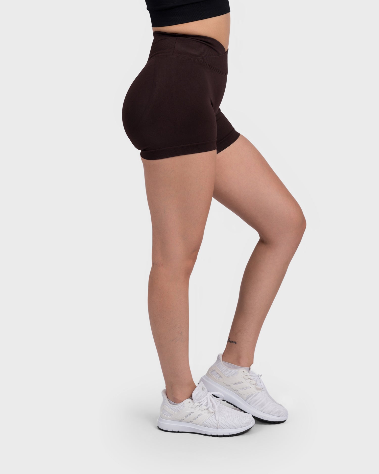 PWG Active Evolve V-Sculpt Shorts in Dark Brown – High-waisted, form-fitting gym shorts with a stylish V-cut waistband - Side View
