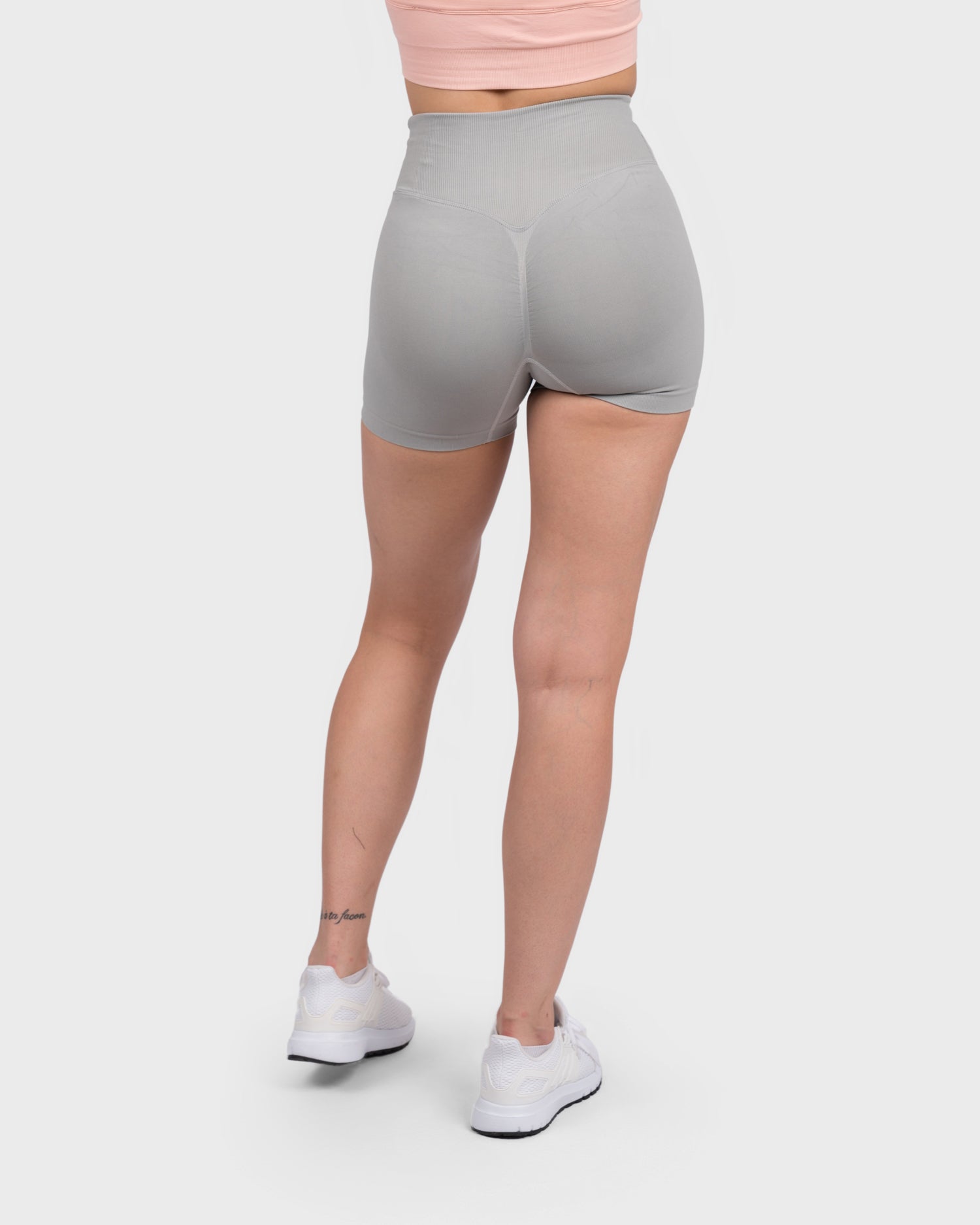 PWG Active Evolve V-Sculpt Shorts in Light Grey – High-waisted, form-fitting gym shorts with a stylish V-cut waistband - Back View