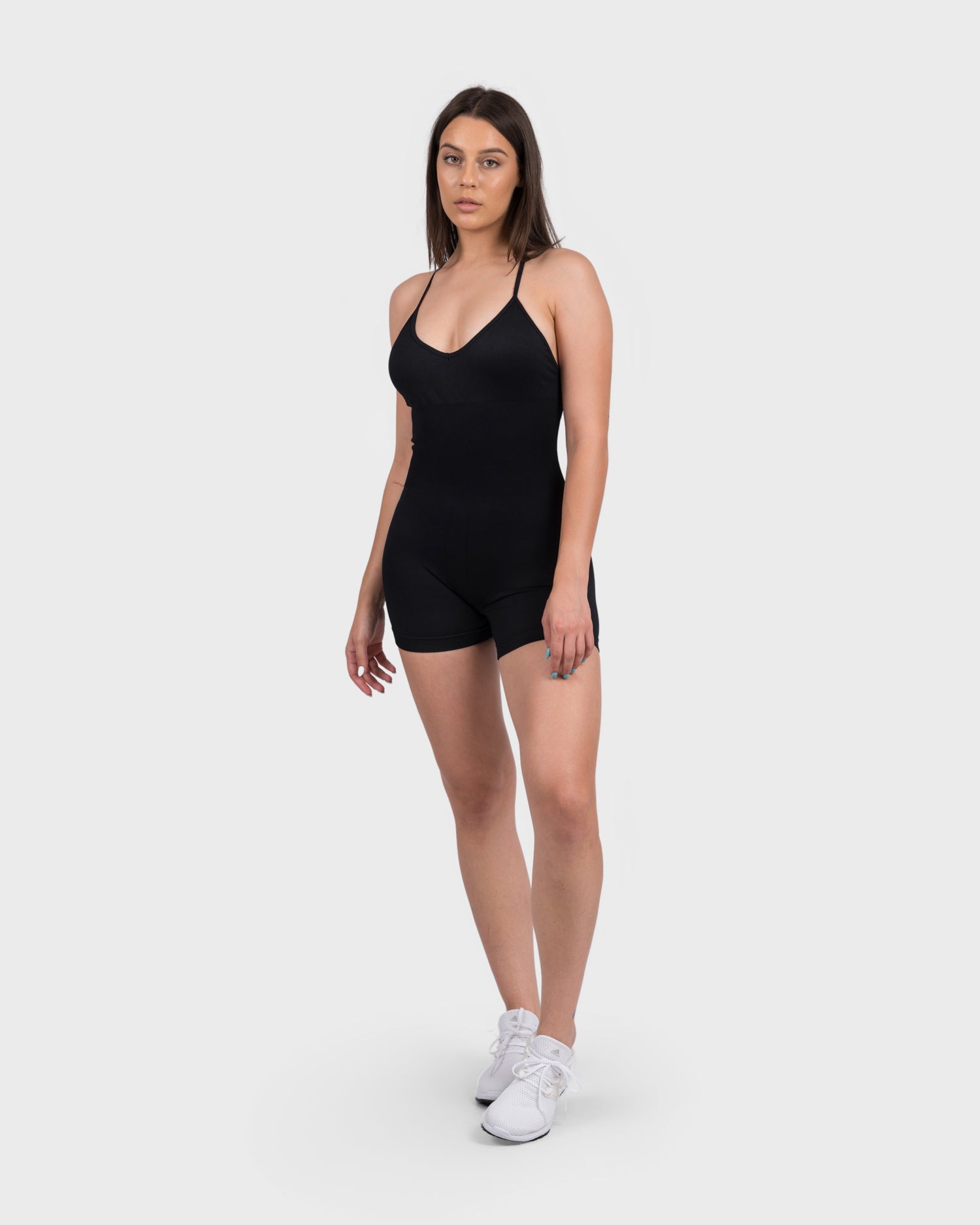 Full-body shot of FlexActive Jumpsuit in black, supportive fit with sculpting design.