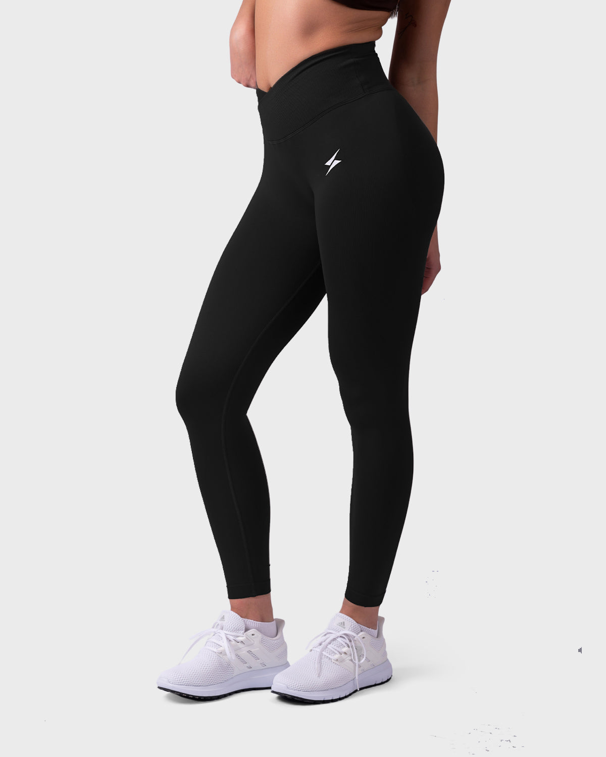 Evolve Sculpt V-Waist Leggings from PWG Active in black, side view with lightning logo.