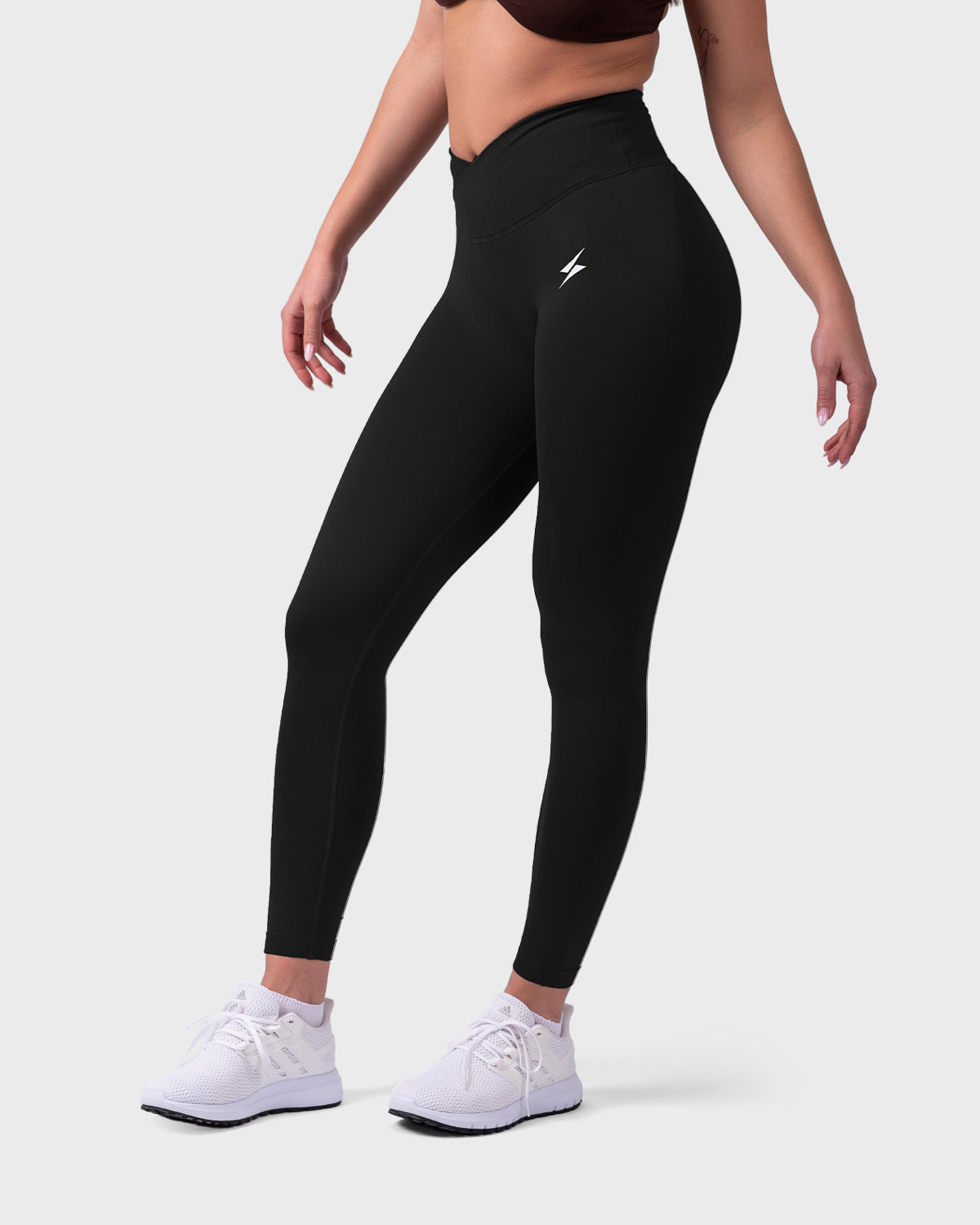Angled front view of Evolve Sculpt V-Waist Leggings, sleek silhouette and support.