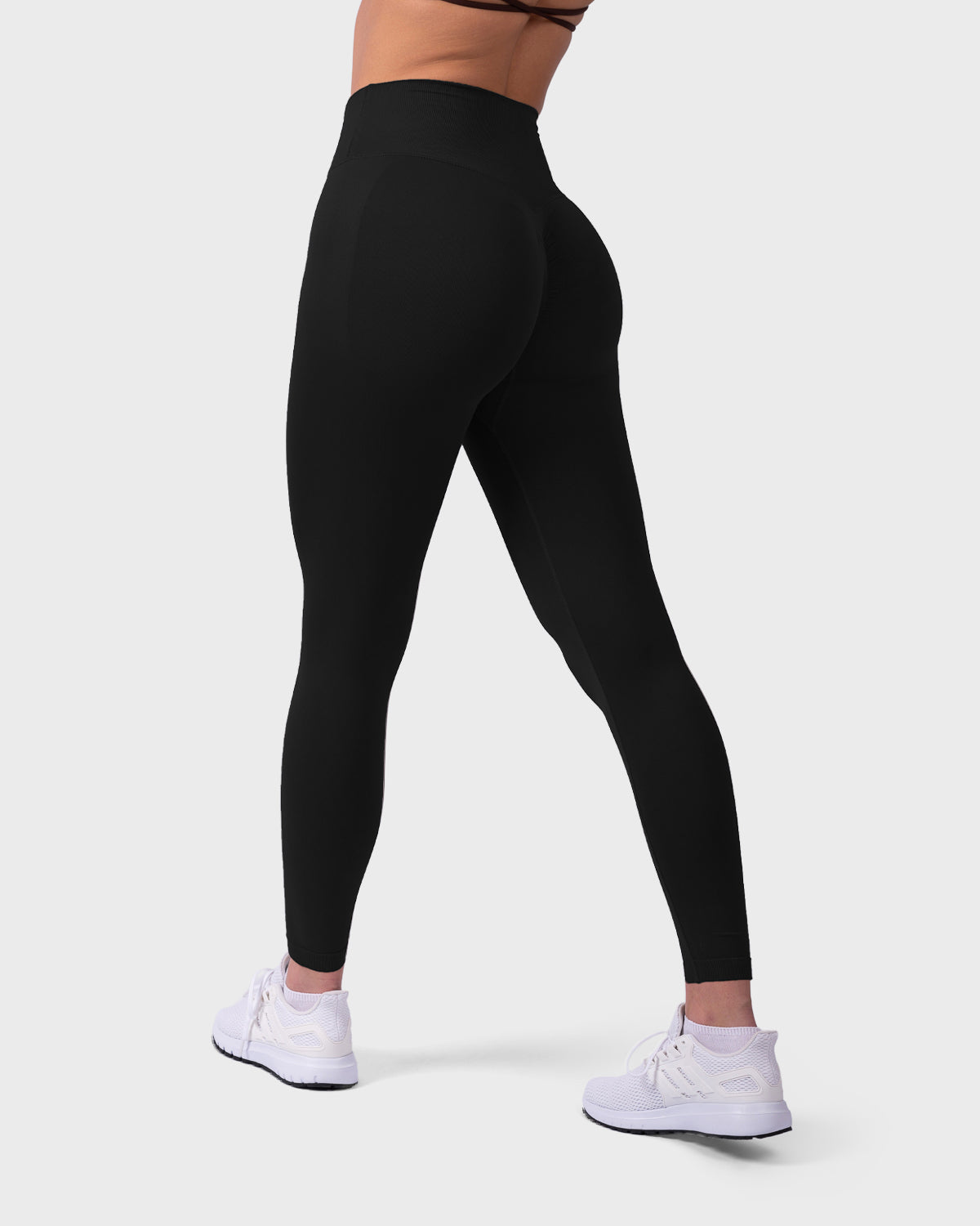 Rear angle of Evolve Sculpt Leggings in black, showing scrunch design and high-rise waist.