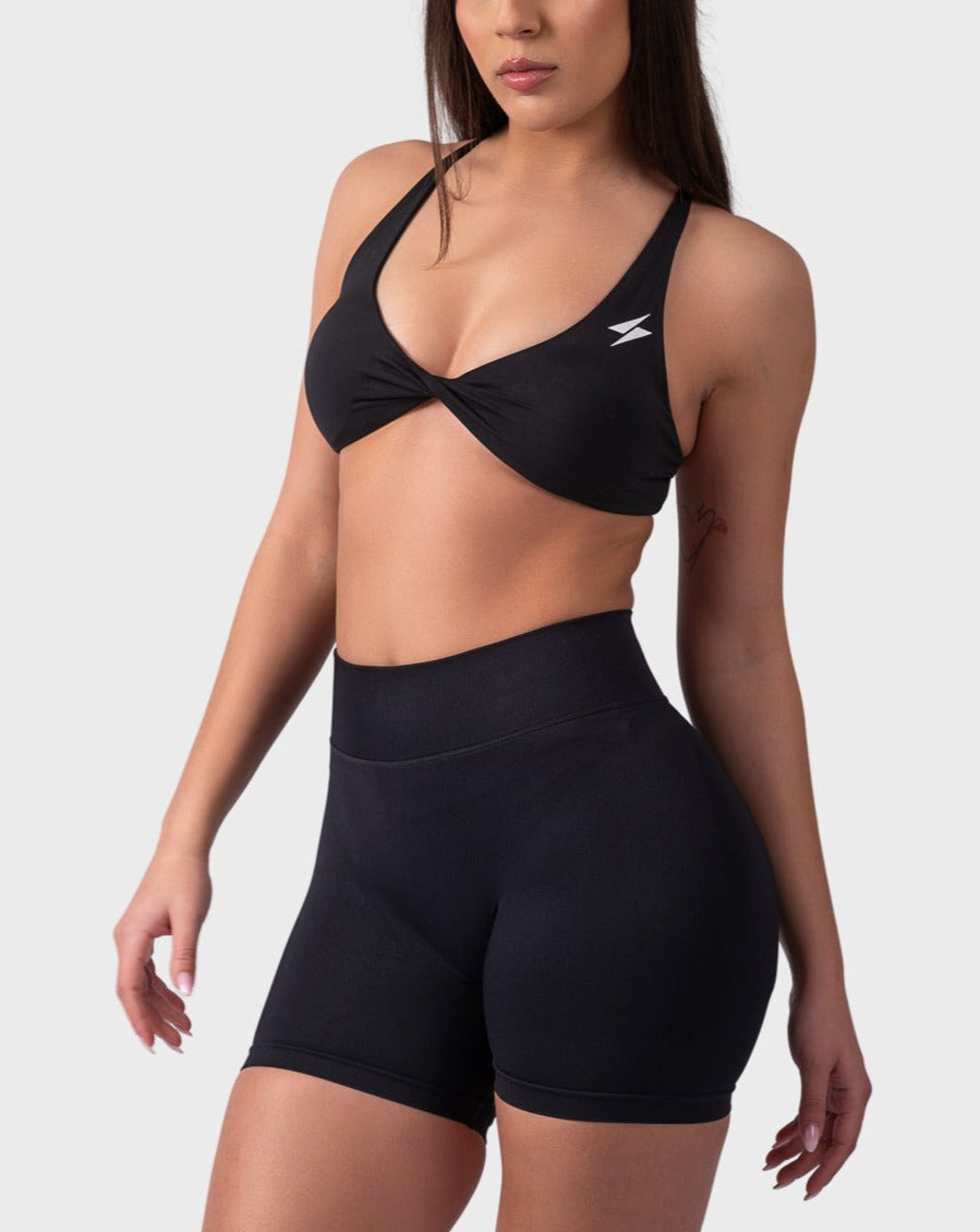 Evolve Backless Sports Bra from PWG Active in black, twist-front design and flattering neckline.