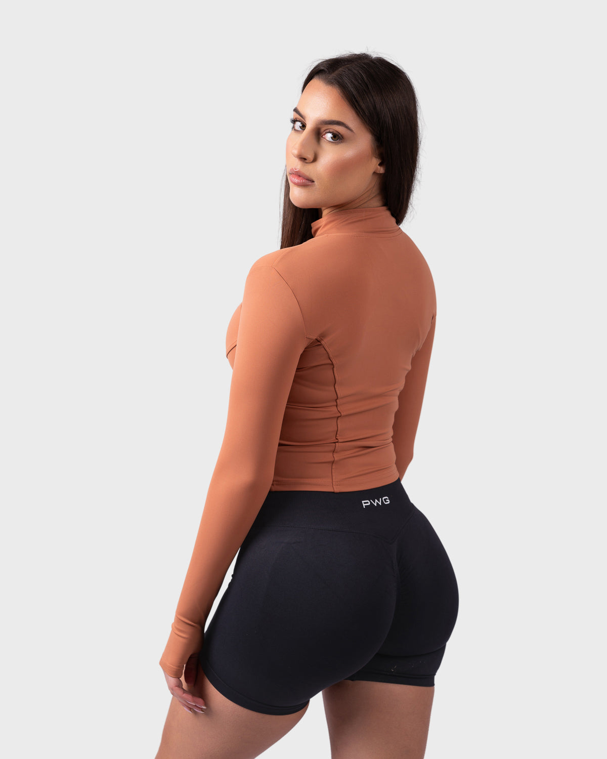 Back view of caramel toffee jacket, fitted design with seam detailing.