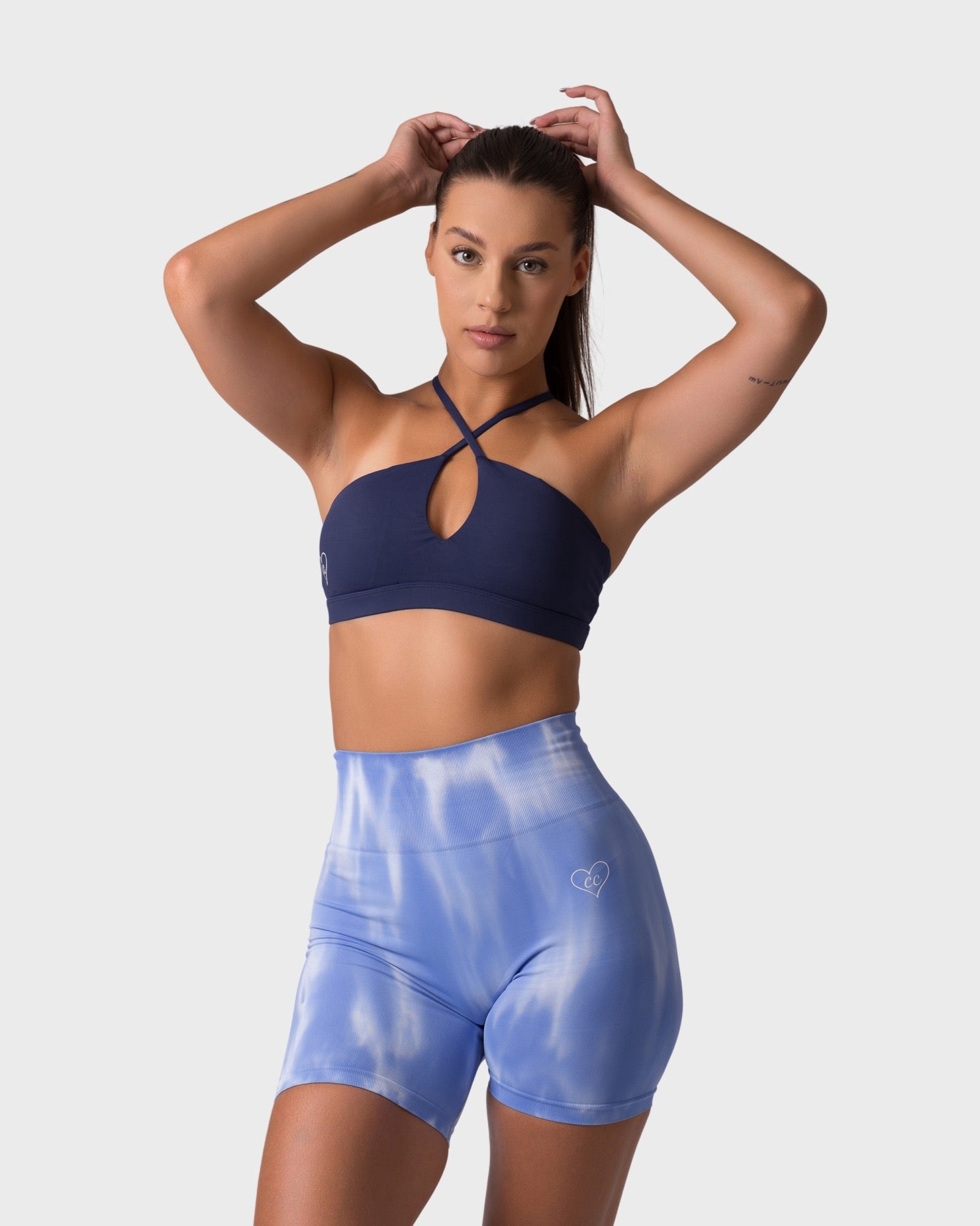 PWG x CC Cross-Shoulder Bra in Navy, eco-friendly, super soft, comfortable, and designed for fitness confidence - Front view
