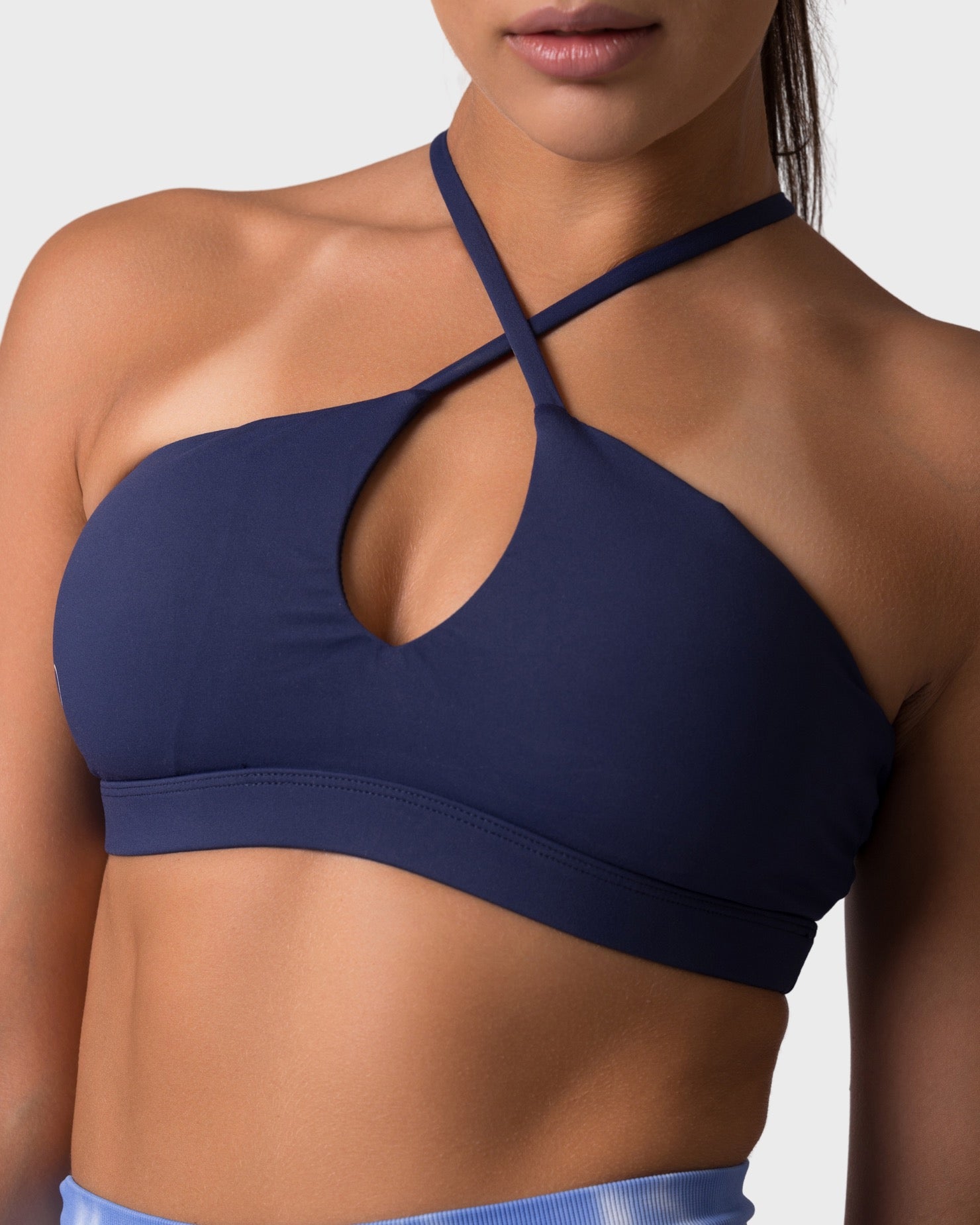 PWG x CC Cross-Shoulder Bra in Navy, eco-friendly, super soft, comfortable, and designed for fitness confidence - Close up