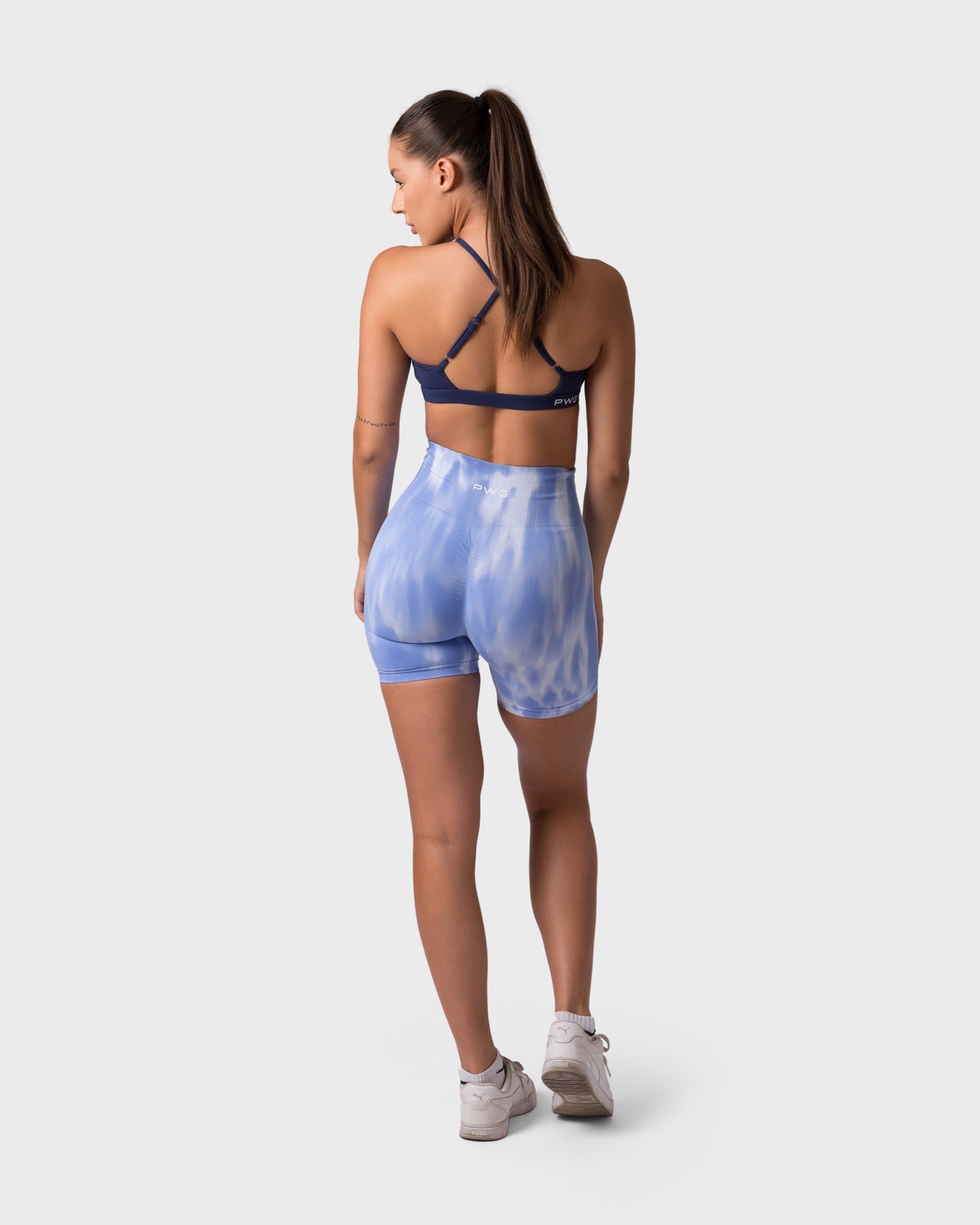 PWG x CC Cross-Shoulder Bra in Navy, eco-friendly, super soft, comfortable, and designed for fitness confidence - Back View