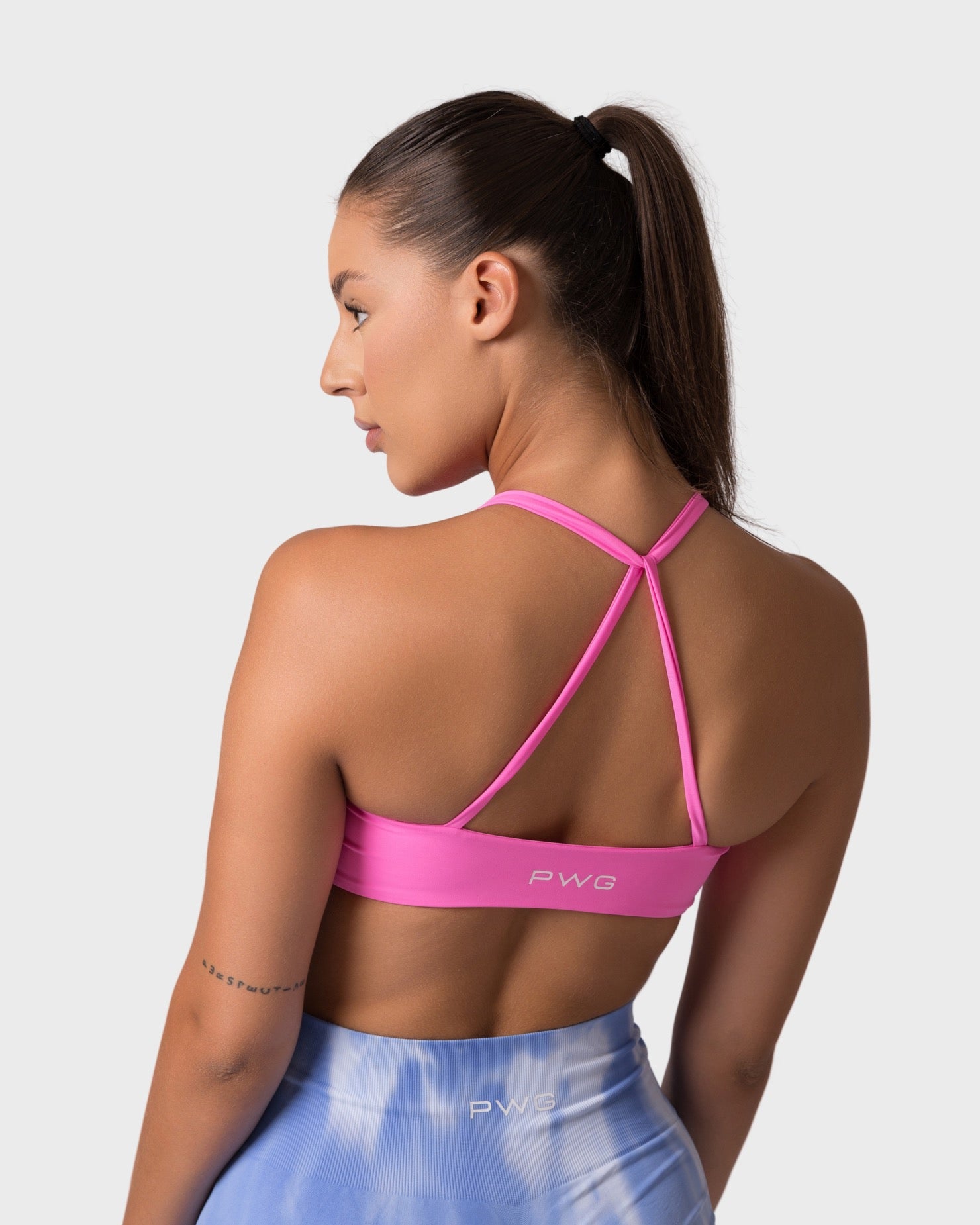PWG x CC Knitted Sports Bra in Rose, Back view showing rose pink crossback straps.