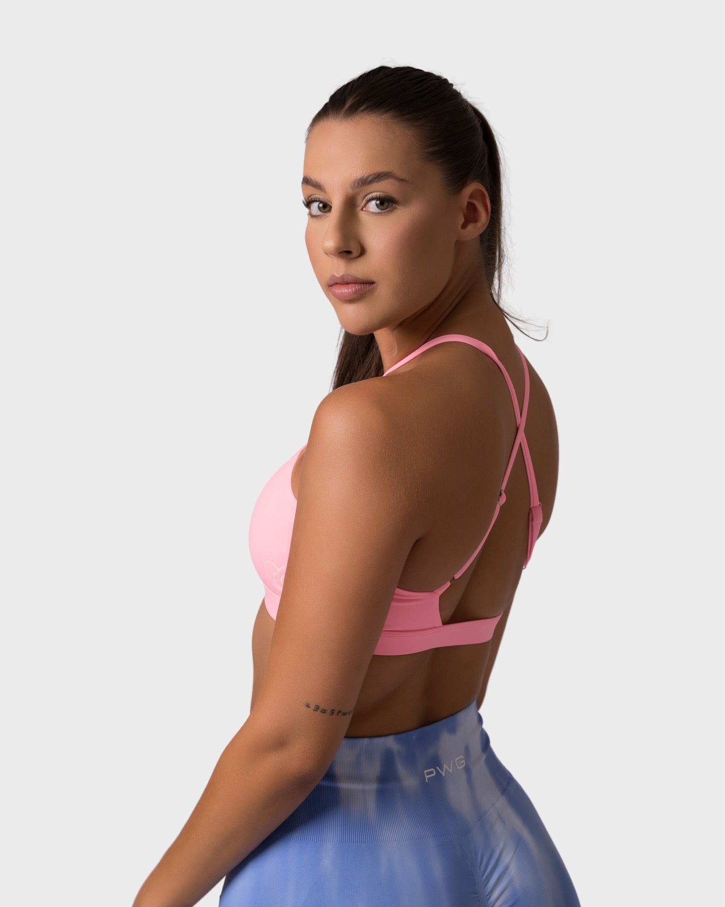PWG x CC Cross-Shoulder Bra in Rose, eco-friendly, super soft, comfortable, and designed for fitness confidence - Side View