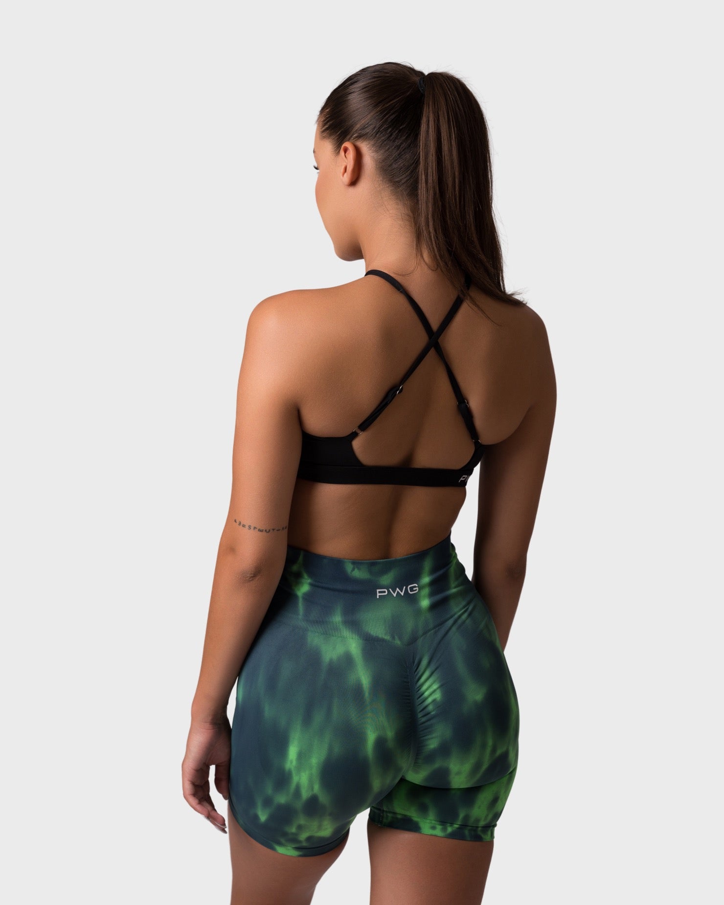 PWG x CC Cross-Shoulder Bra in Black, eco-friendly, super soft, comfortable, and designed for fitness confidence - Back View