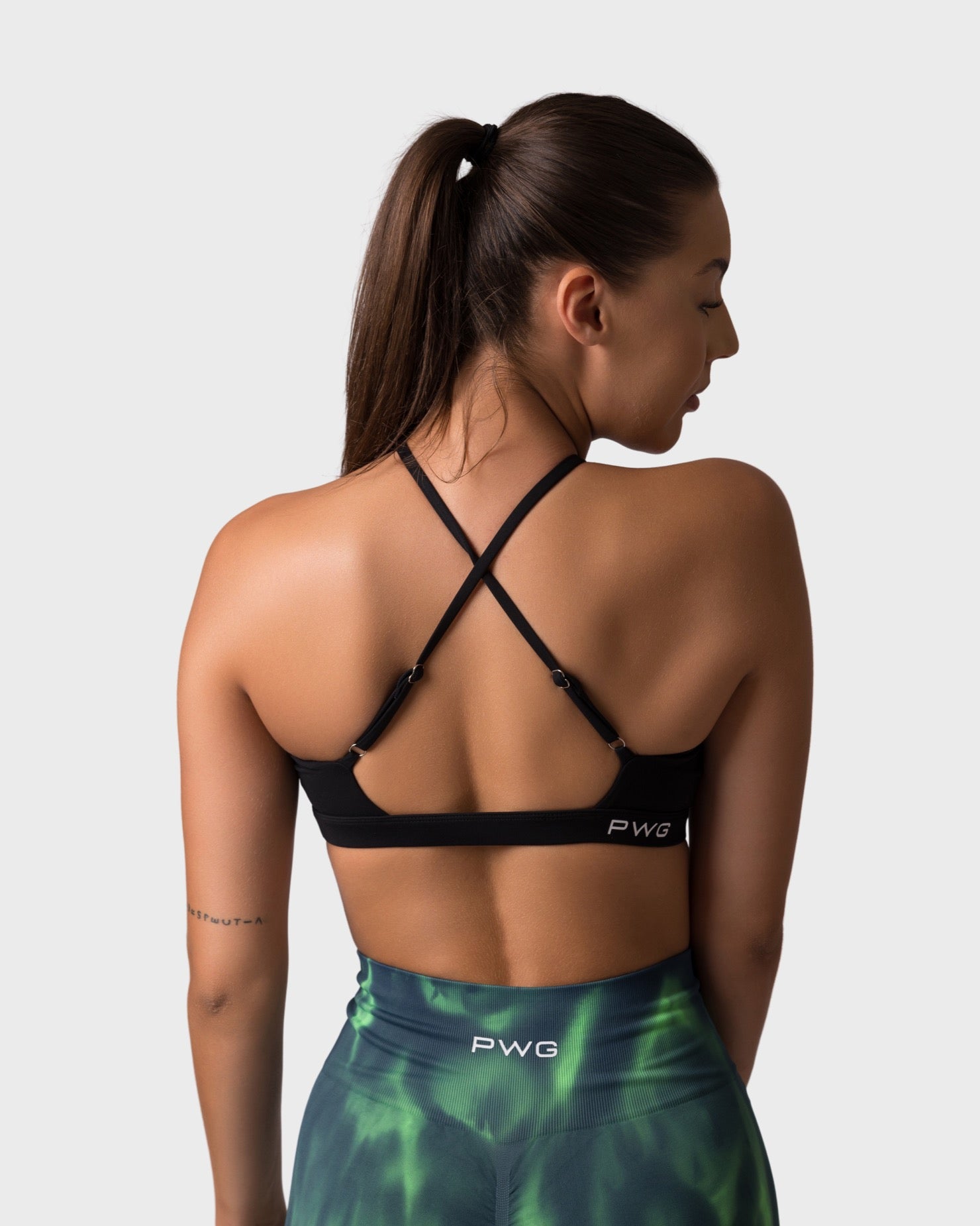 PWG x CC Cross-Shoulder Bra in Black, eco-friendly, super soft, comfortable, and designed for fitness confidence - Back View