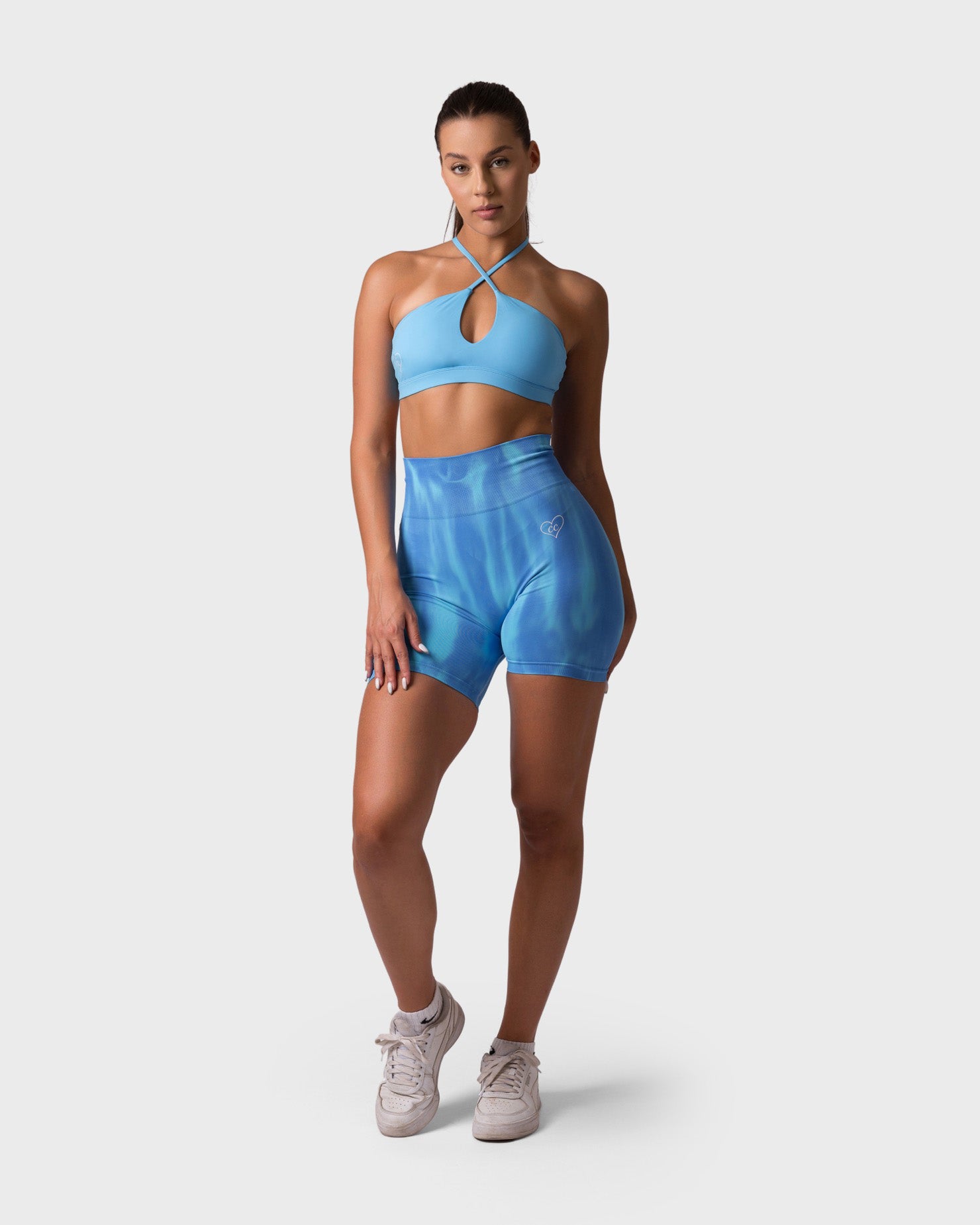 PWG x CC Cross-Shoulder Bra in Ocean Blue, eco-friendly, super soft, comfortable, and designed for fitness confidence