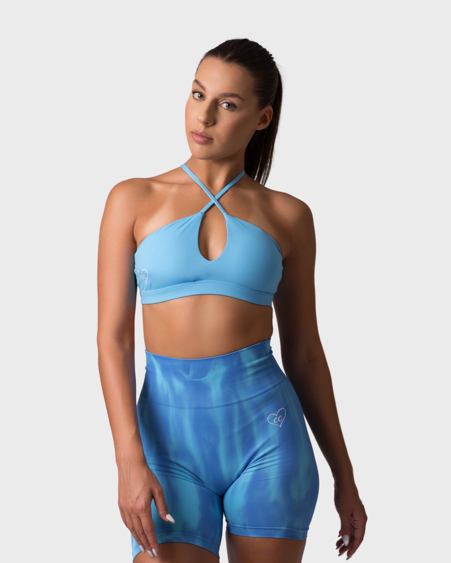 PWG x CC Cross-Shoulder Bra in Ocean Blue, eco-friendly, super soft, comfortable, and designed for fitness confidence