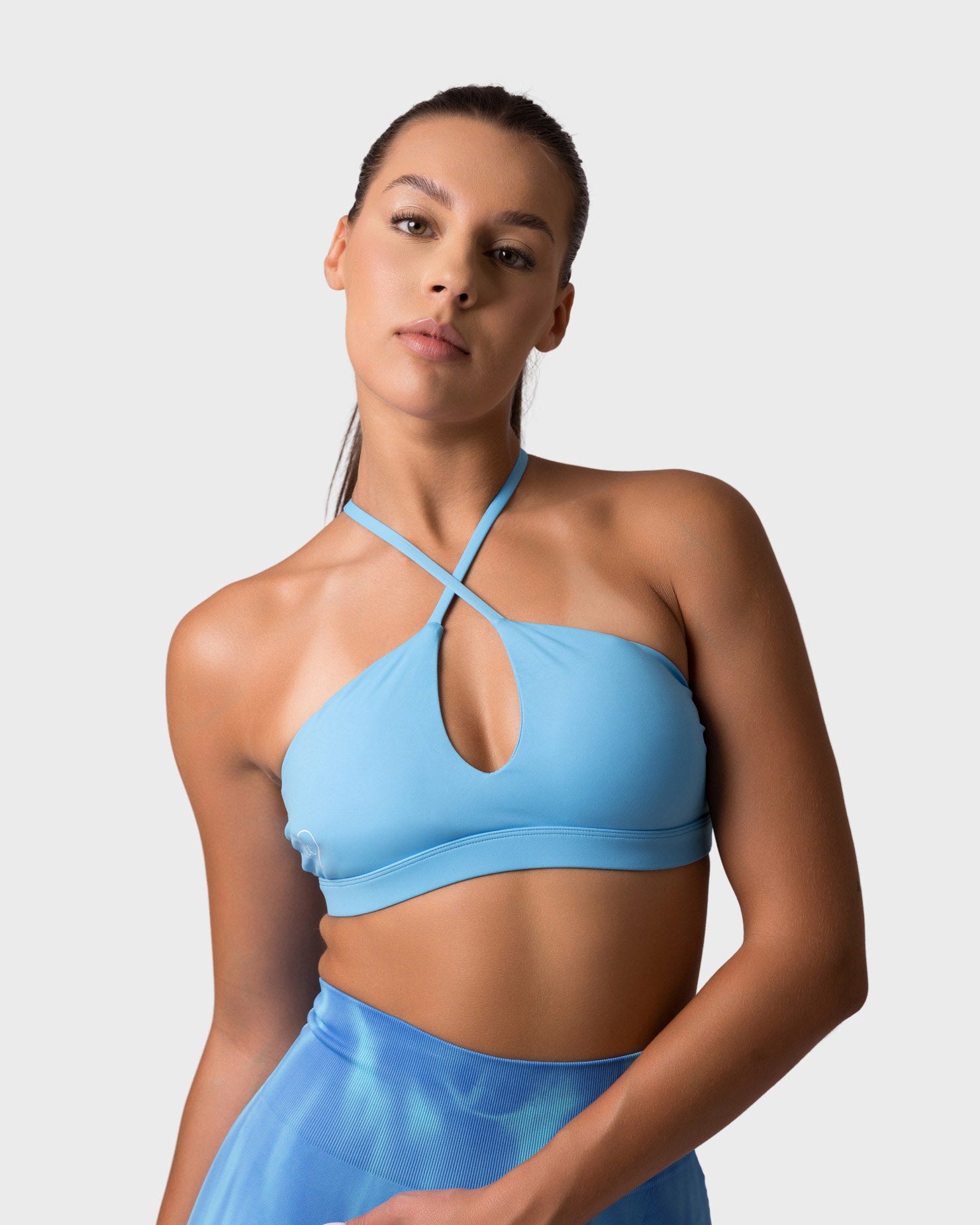 PWG x CC Cross-Shoulder Bra in Ocean Blue, eco-friendly, super soft, comfortable, and designed for fitness confidence - front view