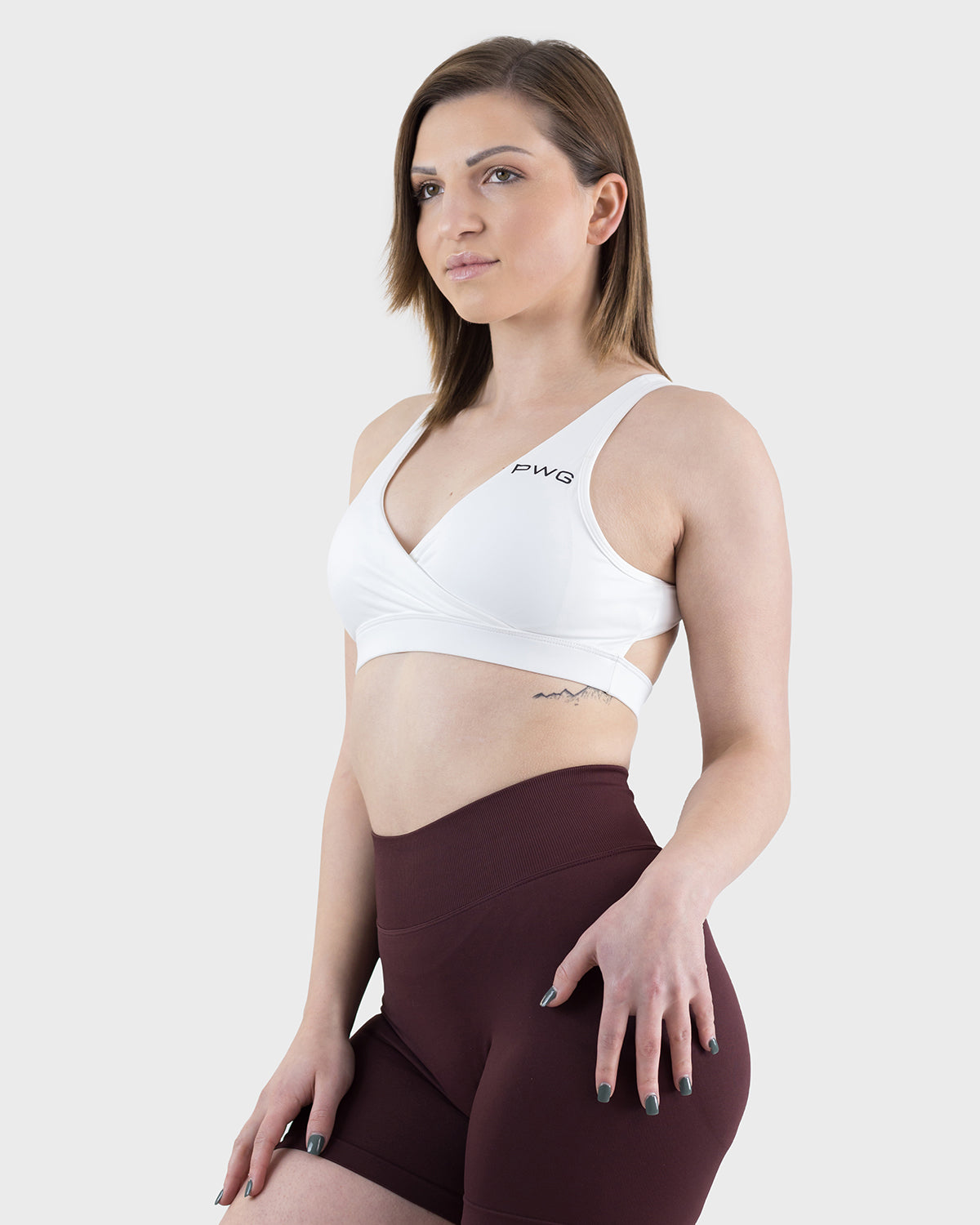 PWG Active Form Open Back Sports Bra in White, plunge V-neck, open back, medium support, removable padding, heat-sealed logo