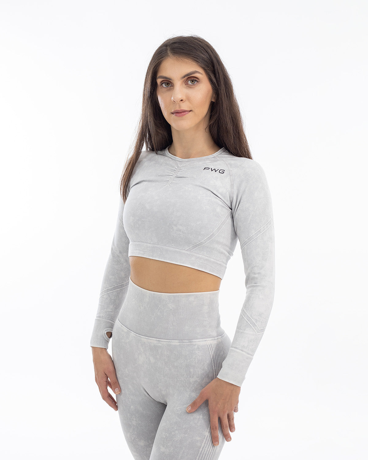 PWG Active Ultra Power Long Sleeve Top in Light Grey, form-fitting, acid wash, front scrunch, thumb holes, embossed detail
