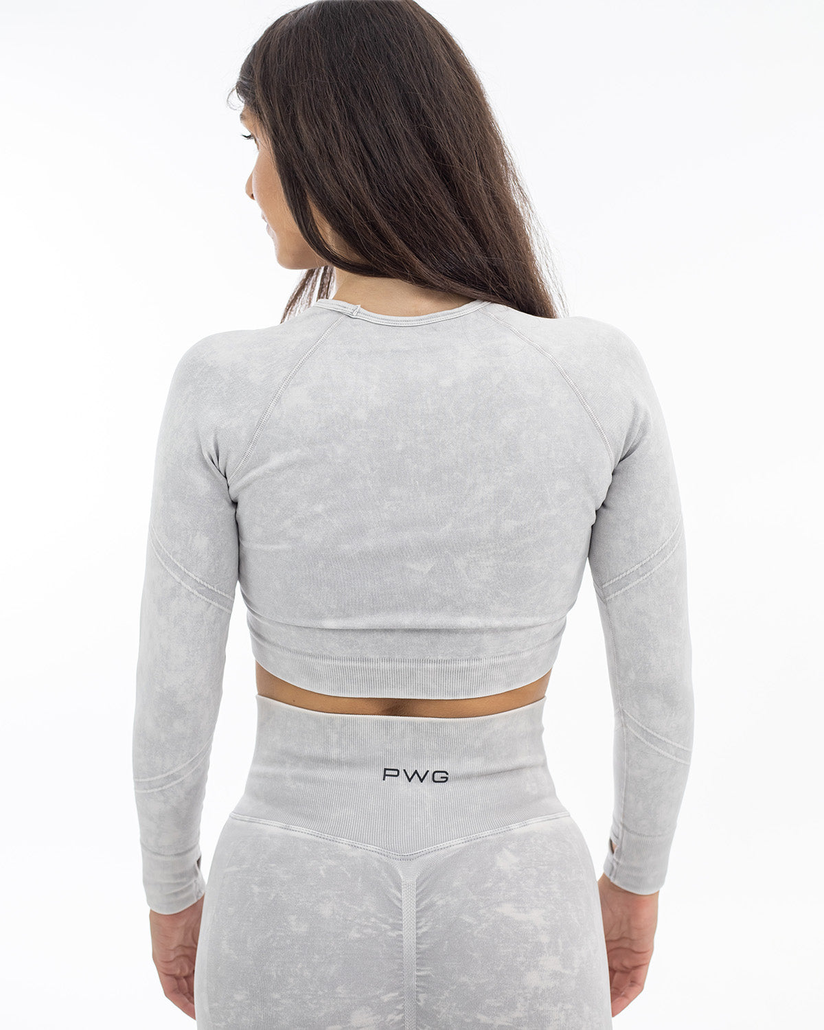 PWG Active Ultra Power Long Sleeve Top in Light Grey, form-fitting, acid wash, front scrunch, thumb holes, embossed detail - Back View