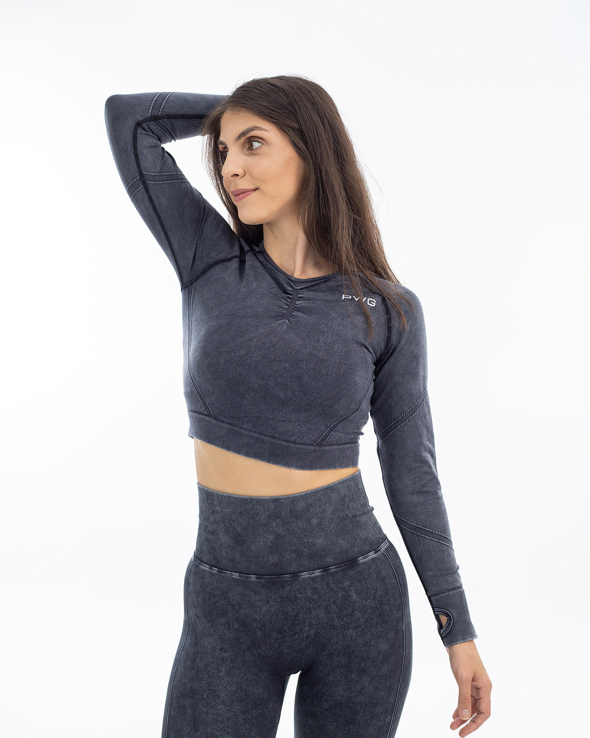 PWG Active Ultra Power Long Sleeve Top in Black, form-fitting, acid wash, front scrunch, thumb holes, embossed detail - Front View