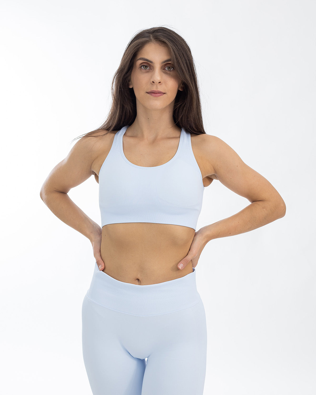 PWG Active Boost+ Open Back Sports Bra in Light Blue, body fit, open back, medium support, plunge neckline, embossed details - Front View
