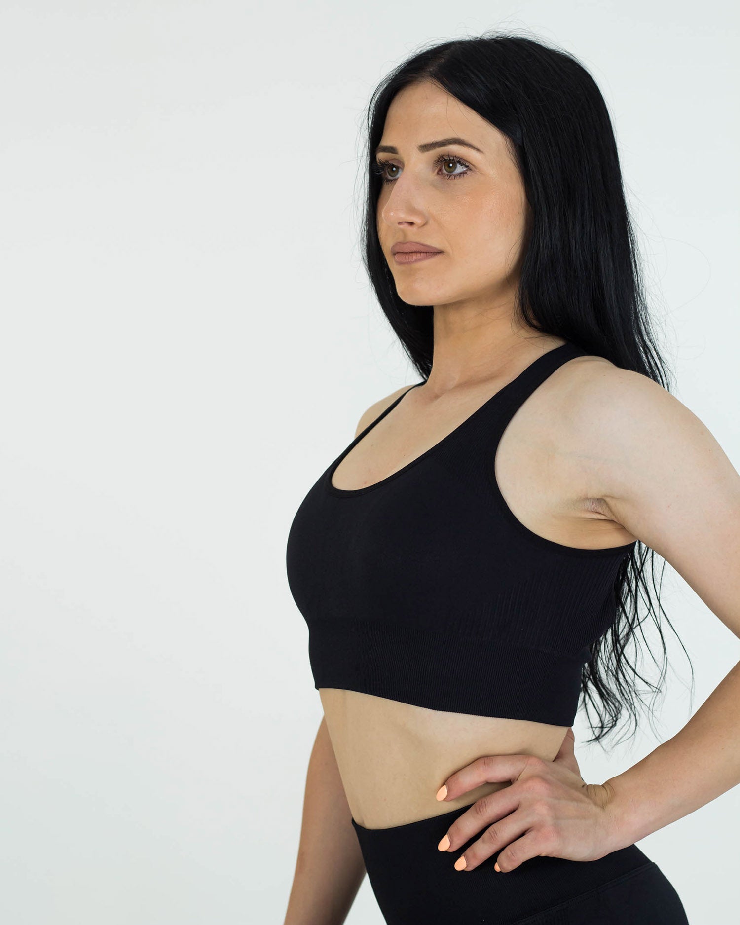 PWG Active Boost+ Open Back Sports Bra in Black, body fit, open back, medium support, plunge neckline, embossed details