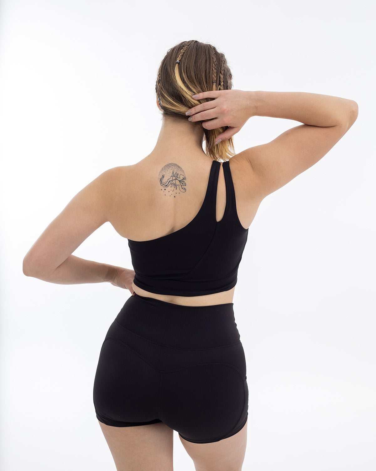 PWG Active Sense Lux One Shoulder Sports Bra in Black, body fit, medium support, embossed contour lines, heat-sealed logo - Back View