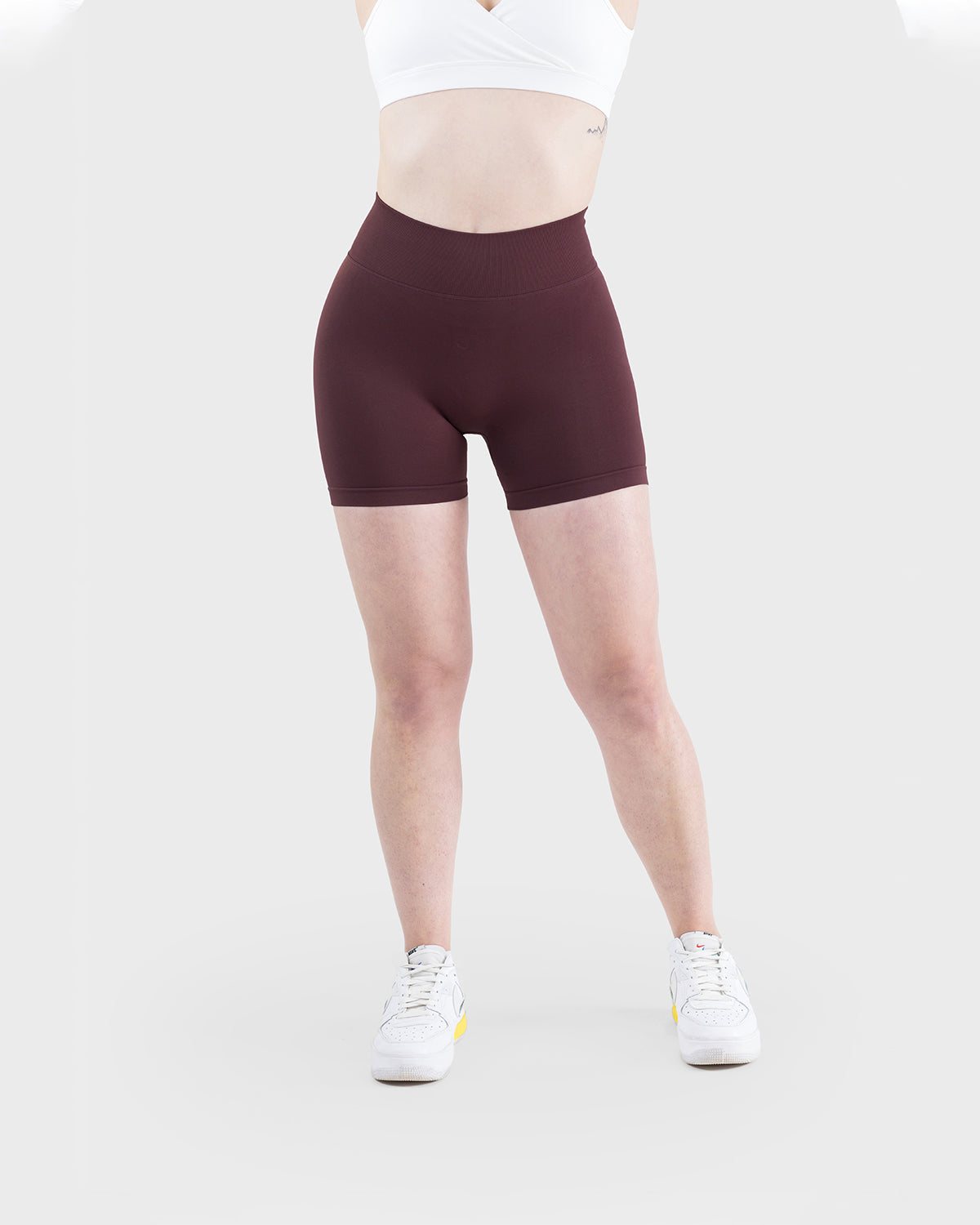 PWG Active Form Sculpting Shorts in Dark Burgundy, high ribbed waistband, sculpting design, scrunch back, 4” inseam - Front View