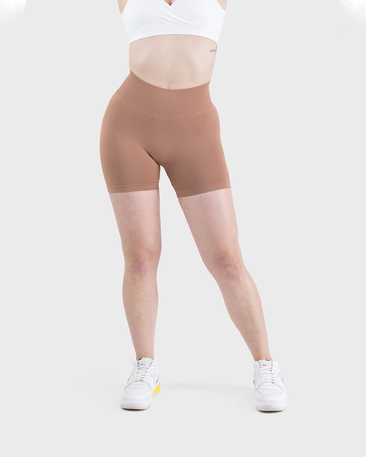 PWG Active Form Sculpting Shorts in Maple Brown, high ribbed waistband, sculpting design, scrunch back, 4” inseam - Front View