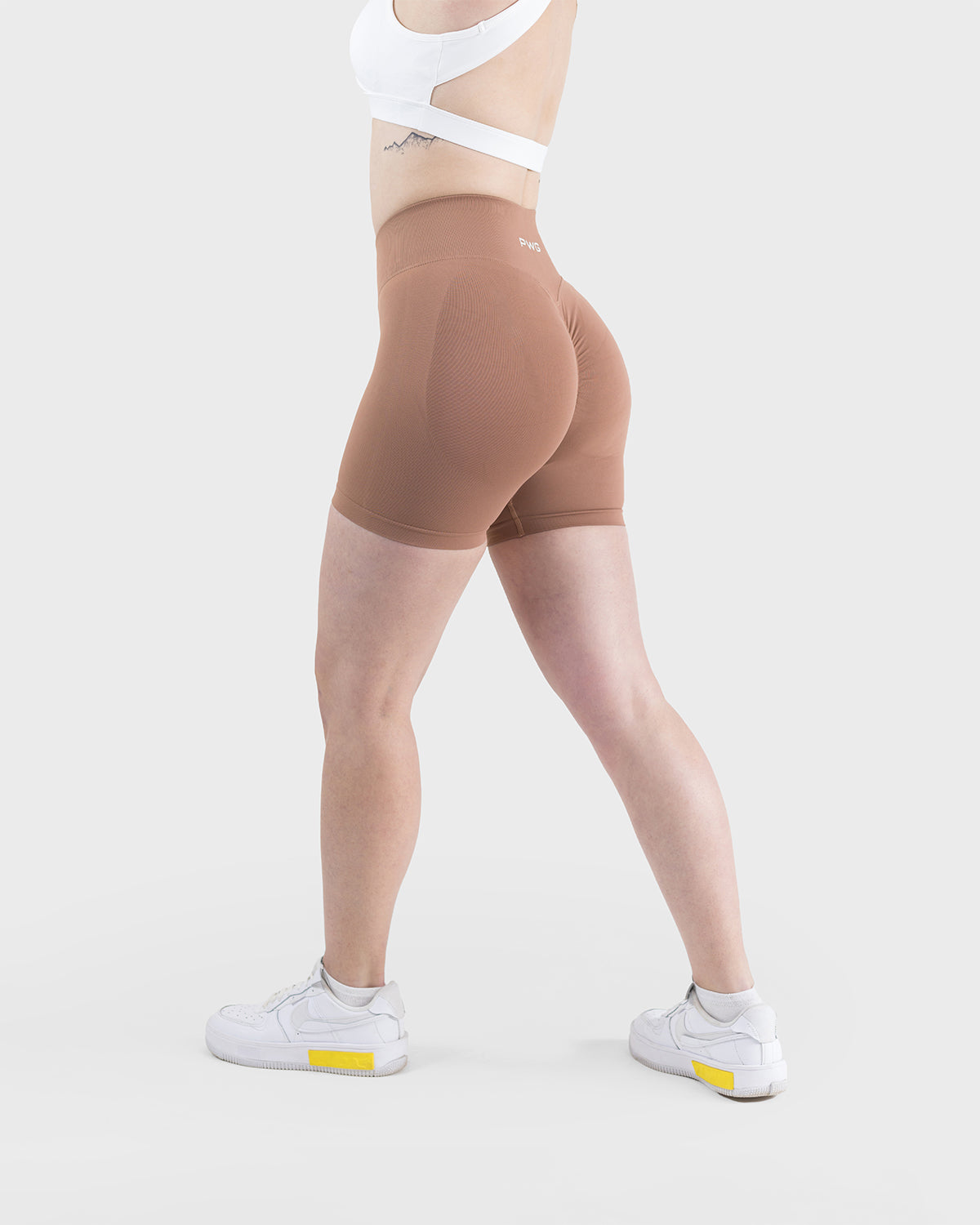 PWG Active Form Sculpting Shorts in Maple Brown, high ribbed waistband, sculpting design, scrunch back, 4” inseam - Side View