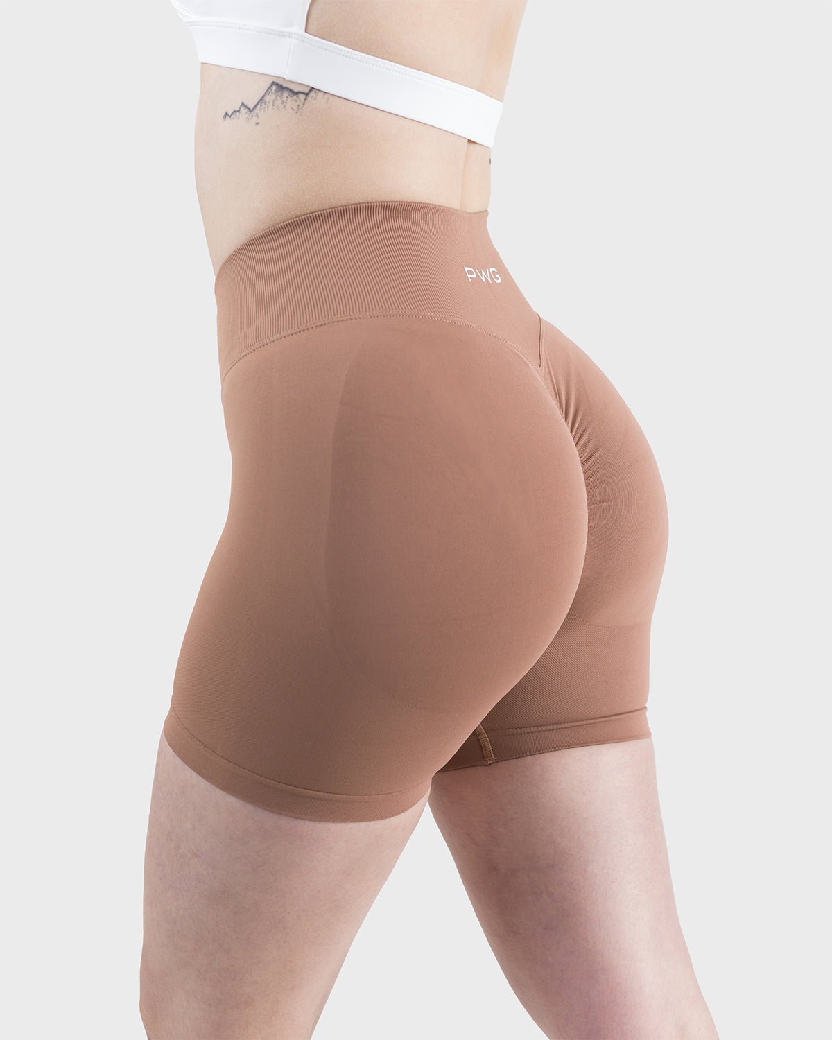 PWG Active Form Sculpting Shorts in Maple Brown, high ribbed waistband, sculpting design, scrunch back, 4” inseam - Side View