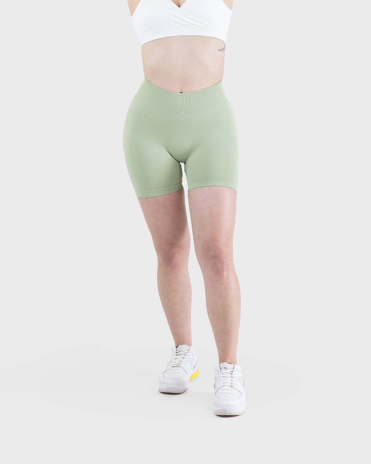 PWG Active Form Sculpting Shorts in Pastel Green, high ribbed waistband, sculpting design, scrunch back, 4” inseam - Front view