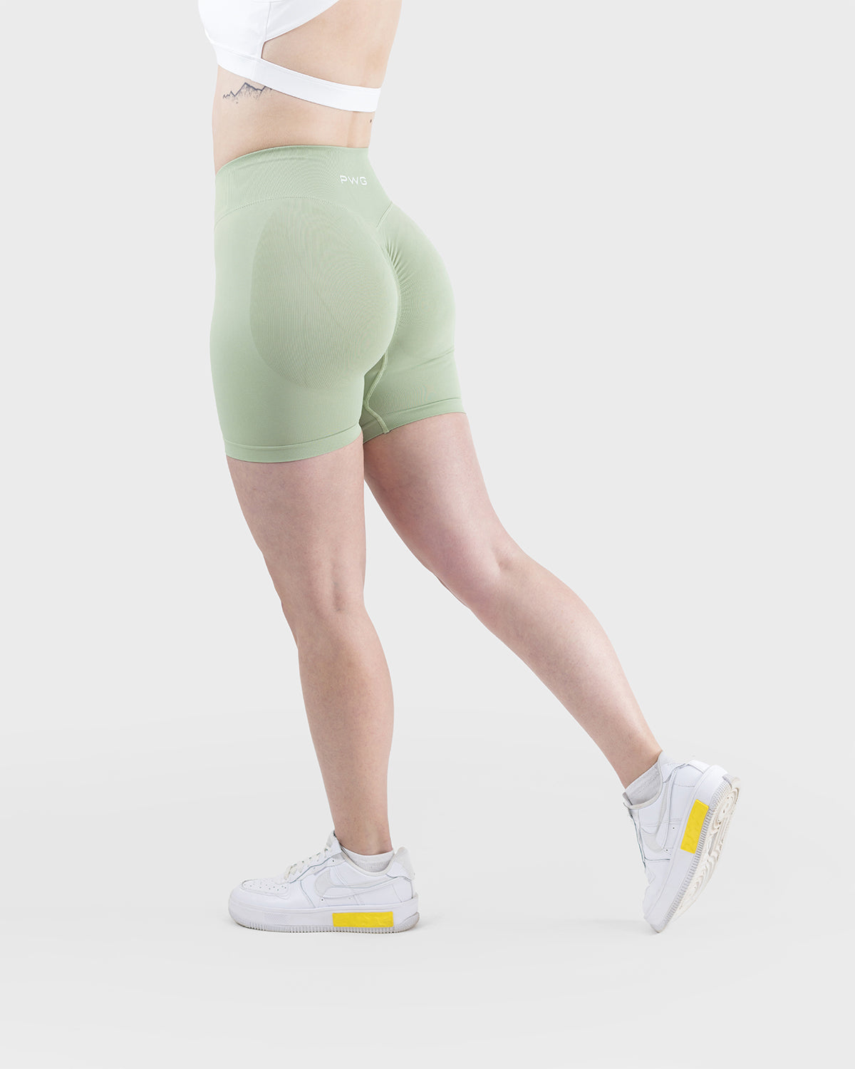 PWG Active Form Sculpting Shorts in Pastel Green, high ribbed waistband, sculpting design, scrunch back, 4” inseam - Side View