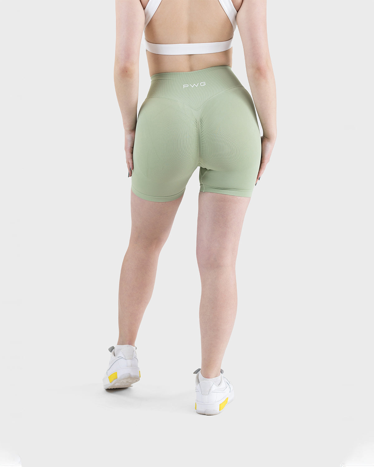 PWG Active Form Sculpting Shorts in Pastel Green, high ribbed waistband, sculpting design, scrunch back, 4” inseam - Back View