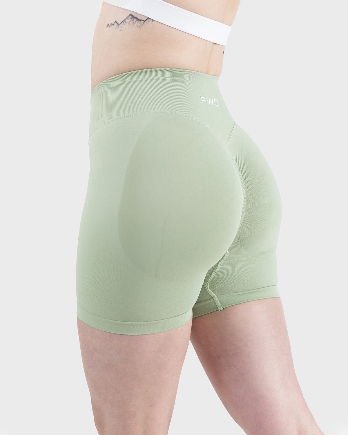 PWG Active Form Sculpting Shorts in Pastel Green, high ribbed waistband, sculpting design, scrunch back, 4” inseam - Side View