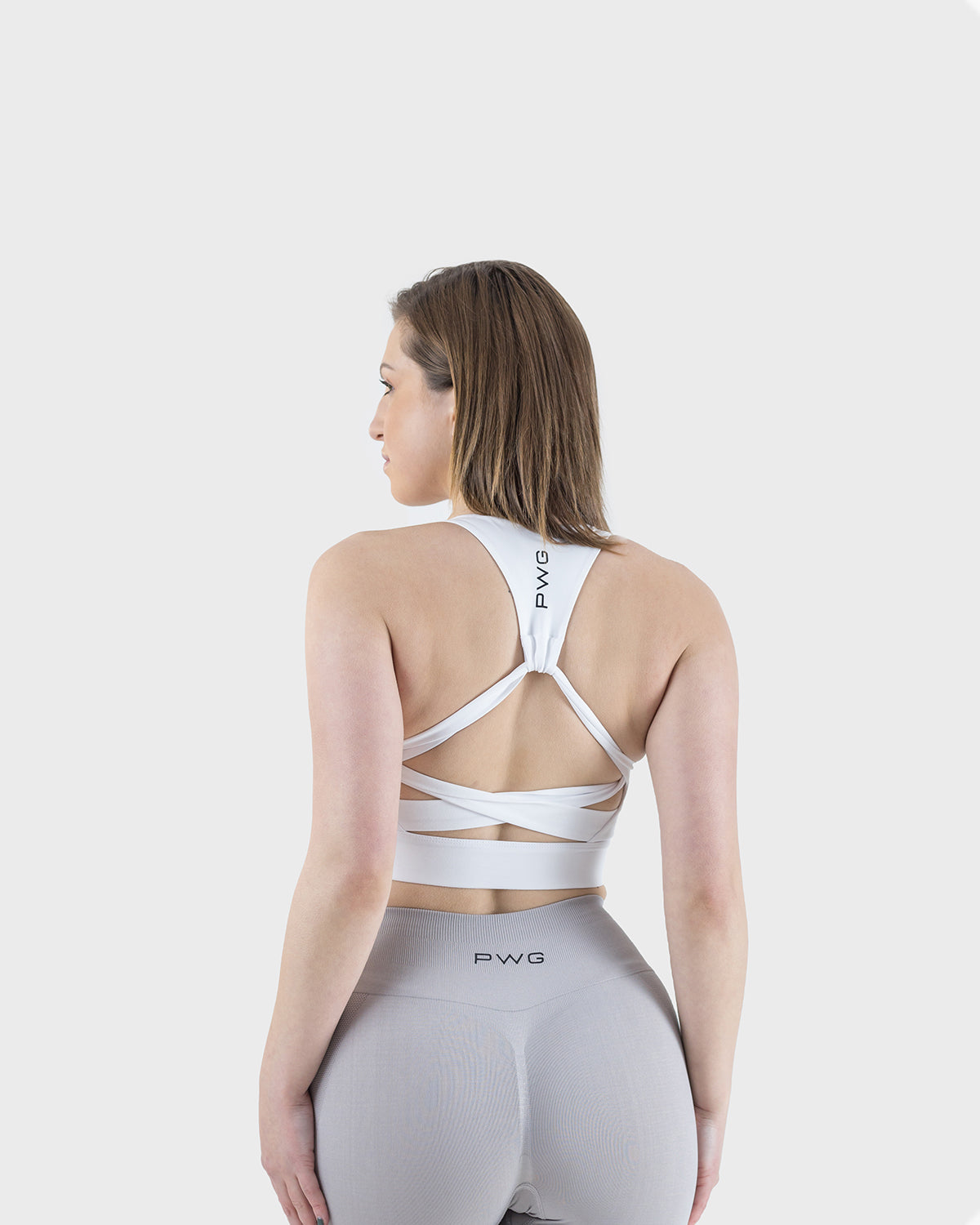PWG Active Arise Sports Bra in White, body fit, medium support, crossed back straps, plunge neckline, removable padding - Back View